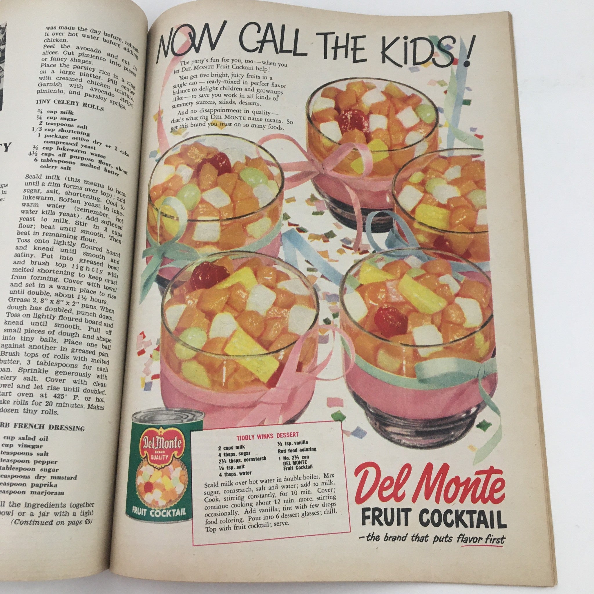 Colorful advertisement for Del Monte Fruit Cocktail in Everywoman's Magazine May 1951, showcasing desserts and recipes for kids.