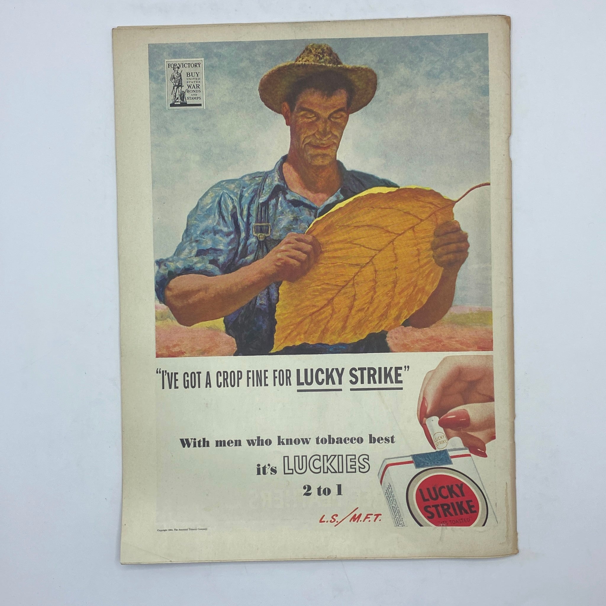 Advertisement page from The New Yorker magazine January 22, 1944, featuring a farmer holding a large tobacco leaf promoting Lucky Strike cigarettes.