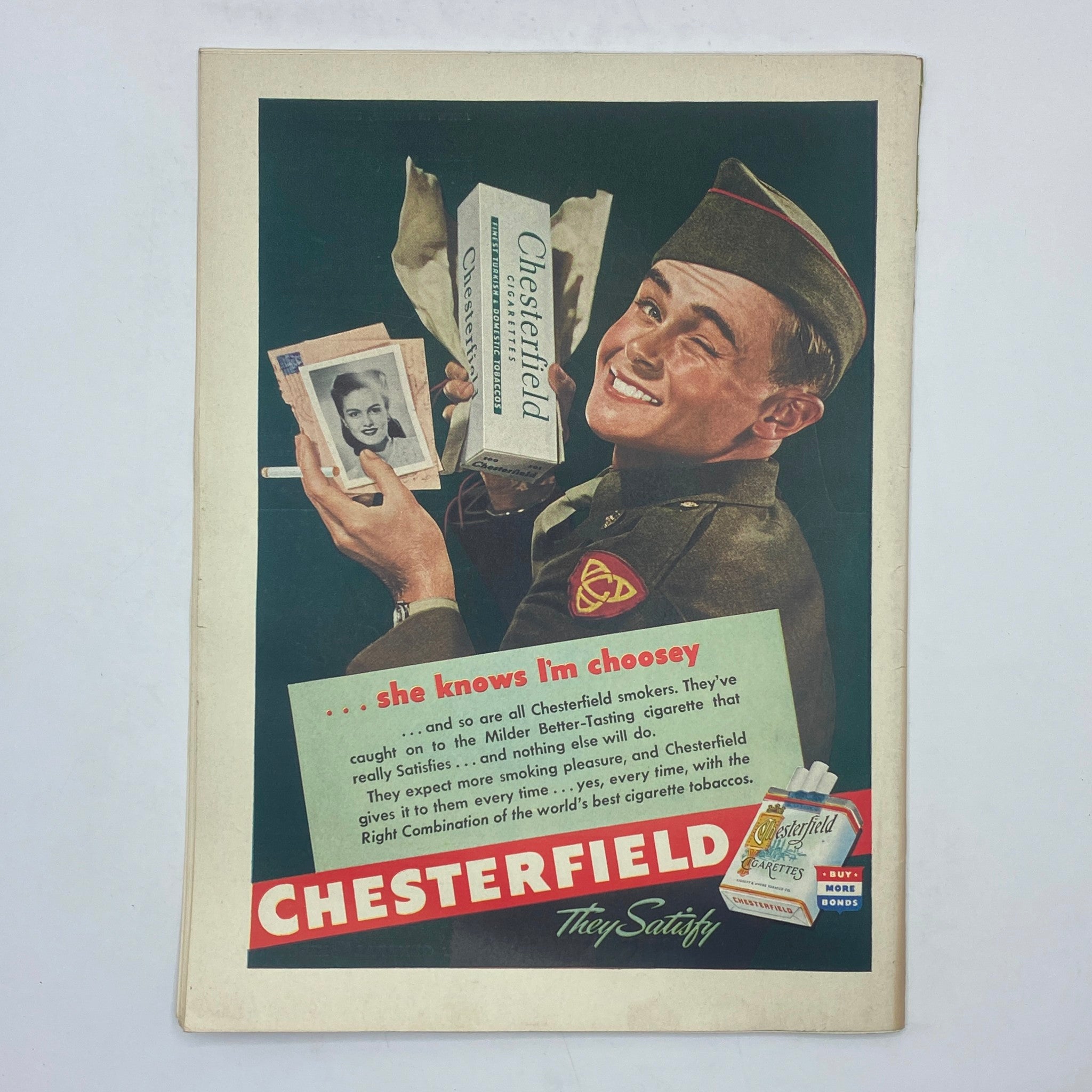 Chesterfield cigarette advertisement from The New Yorker magazine January 29, 1944 featuring a soldier holding a Chesterfield pack.