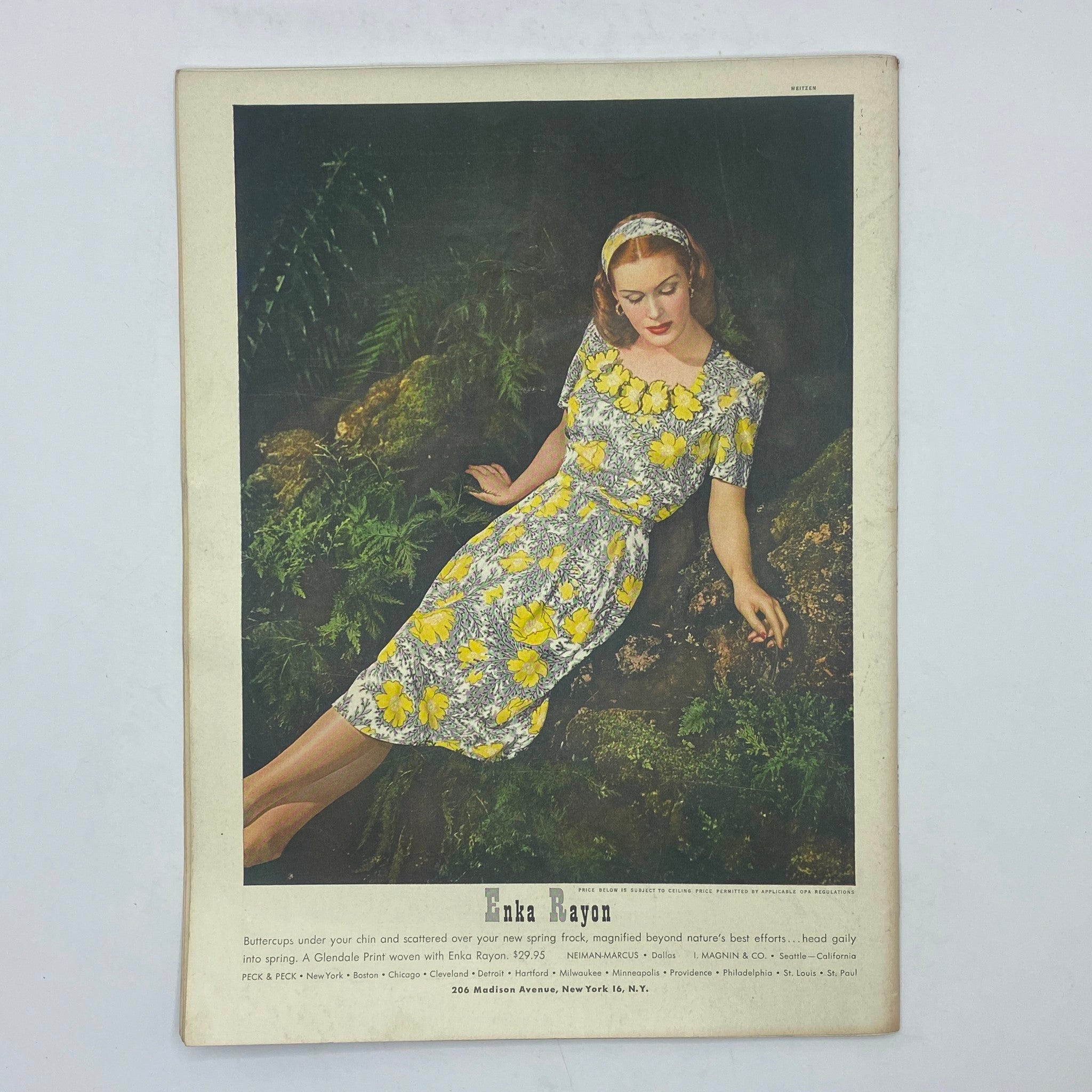 Vintage advertisement showcasing a woman wearing a floral dress made of Enka Rayon, from The New Yorker magazine dated February 5, 1944.