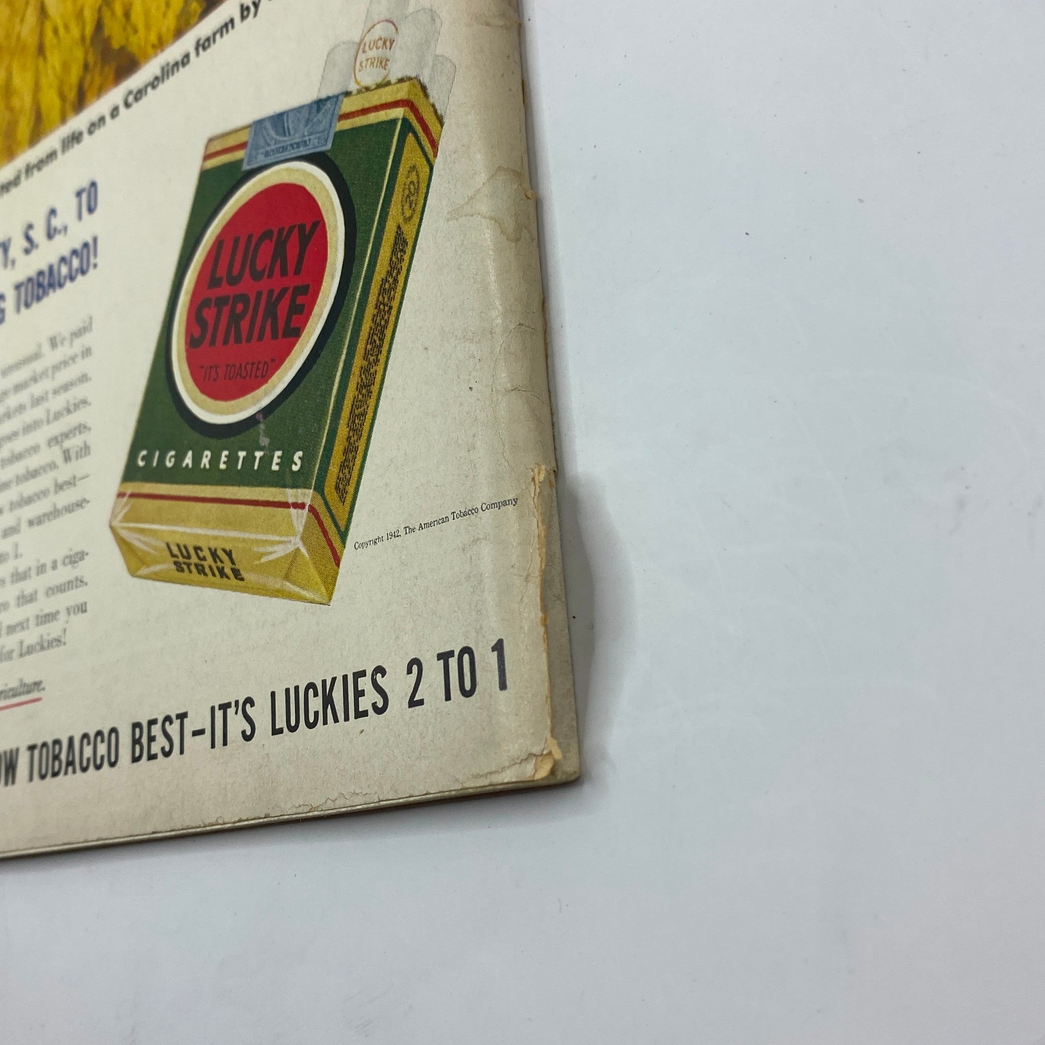 Advertisement for Lucky Strike cigarettes from The New Yorker Complete Magazine April 18, 1942 Perry Barlow Cover, featuring a vintage cigarette box design.