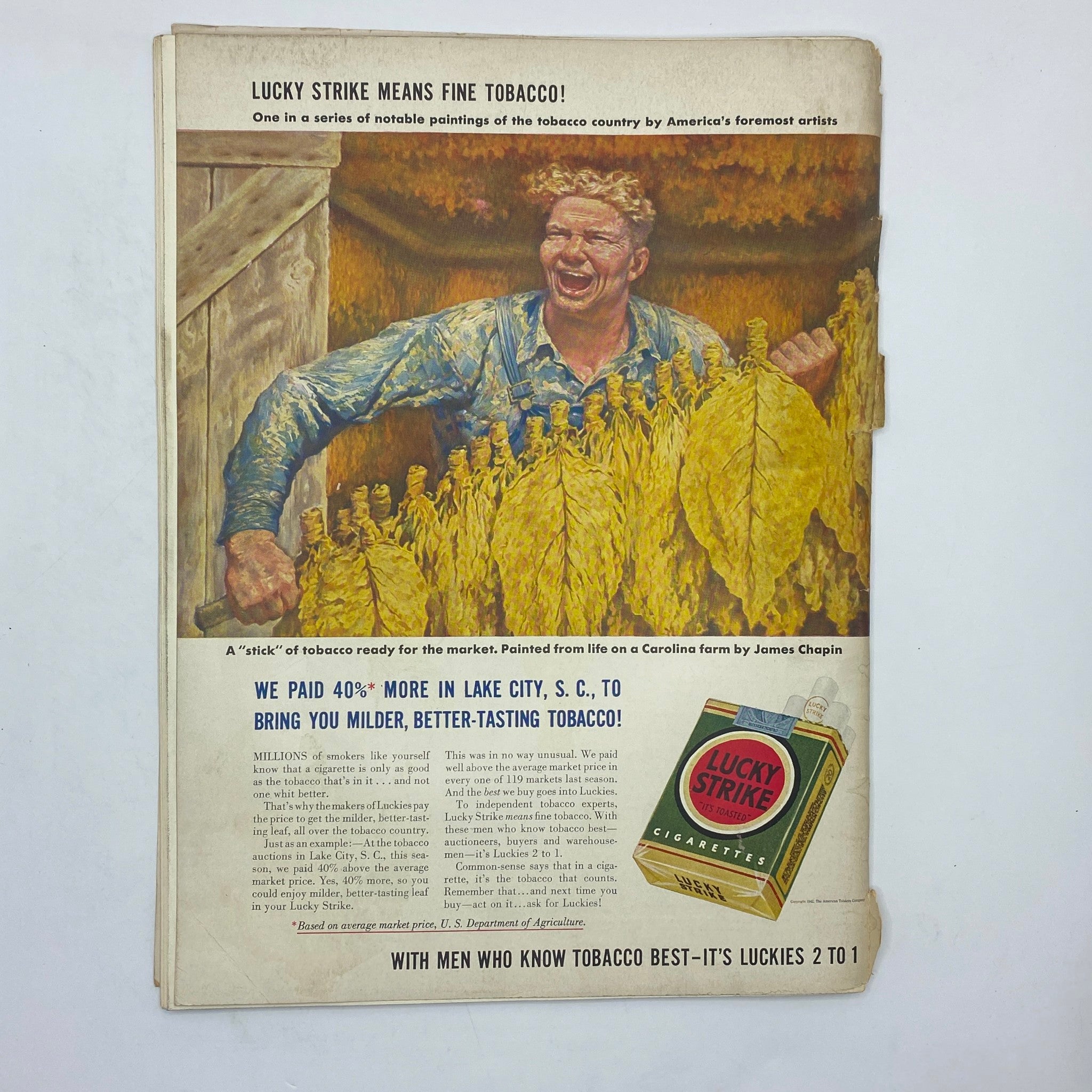 Lucky Strike advertisement featuring a joyful man amidst tobacco leaves. The ad highlights fine tobacco quality and is painted by James Chapin. Promotes the magazine The New Yorker Complete Magazine April 18, 1942 Perry Barlow Cover.