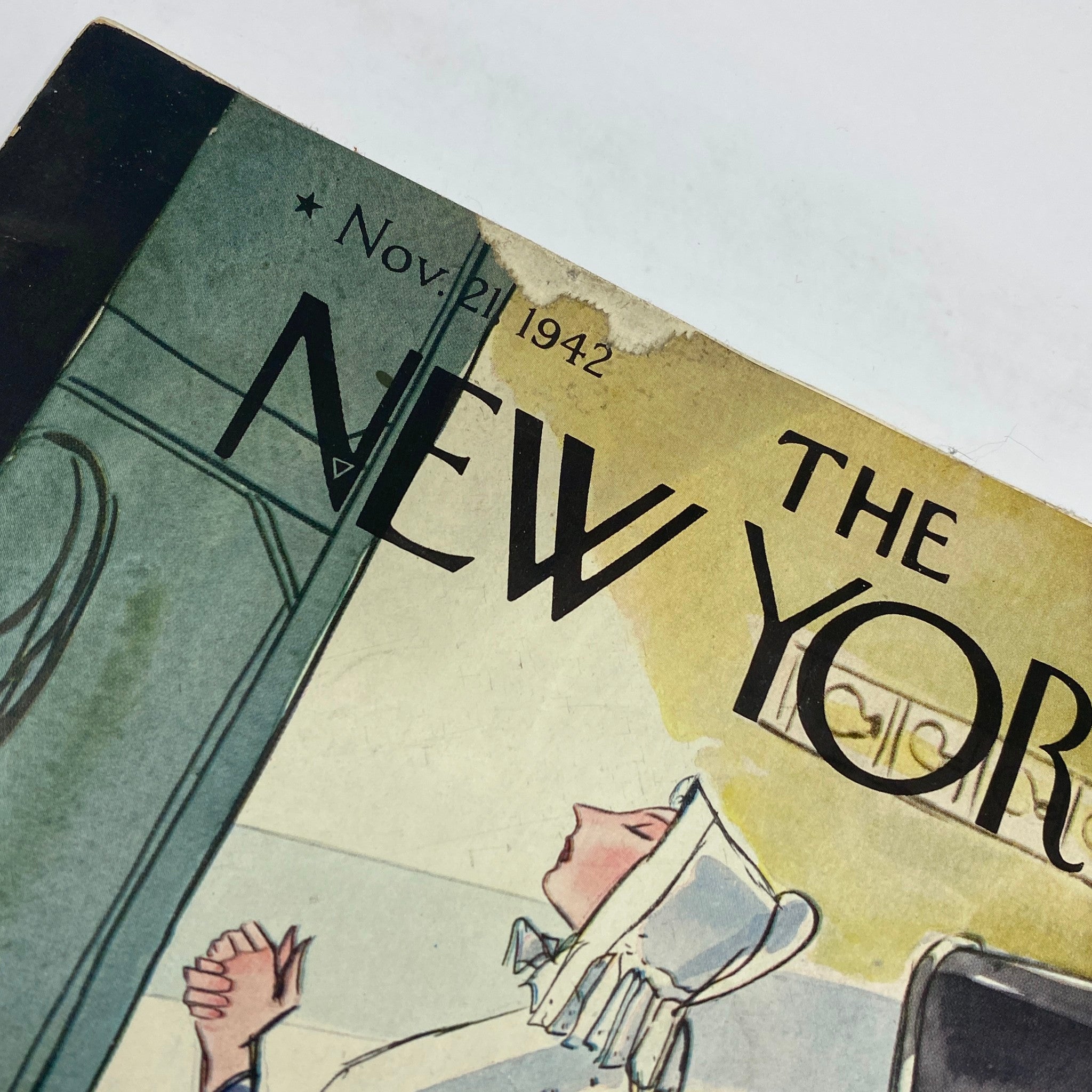 Close-up of the top section of The New Yorker magazine cover from November 21, 1942, showcasing the title and date.