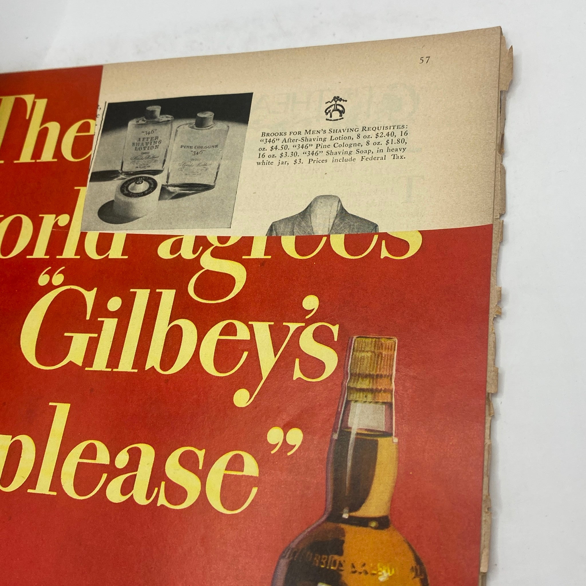 Page from The New Yorker Complete Magazine November 29, 1947 displaying an advertisement for Gilbey's, featuring a bottle and grooming products, representative of mid-20th-century marketing.