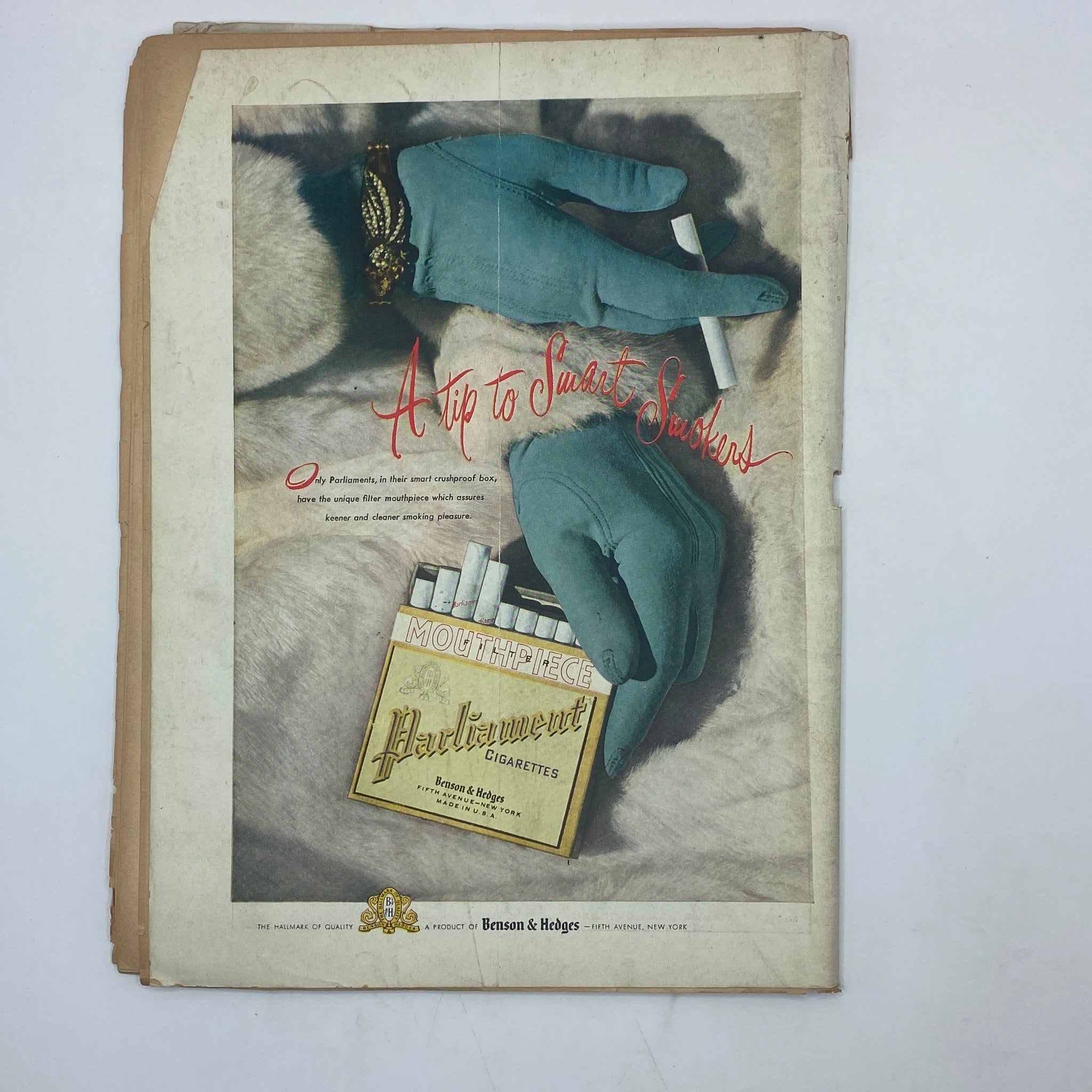 Vintage advertisement from The New Yorker Complete Magazine October 25, 1947 featuring stylish gloves and a pack of Parliament cigarettes.