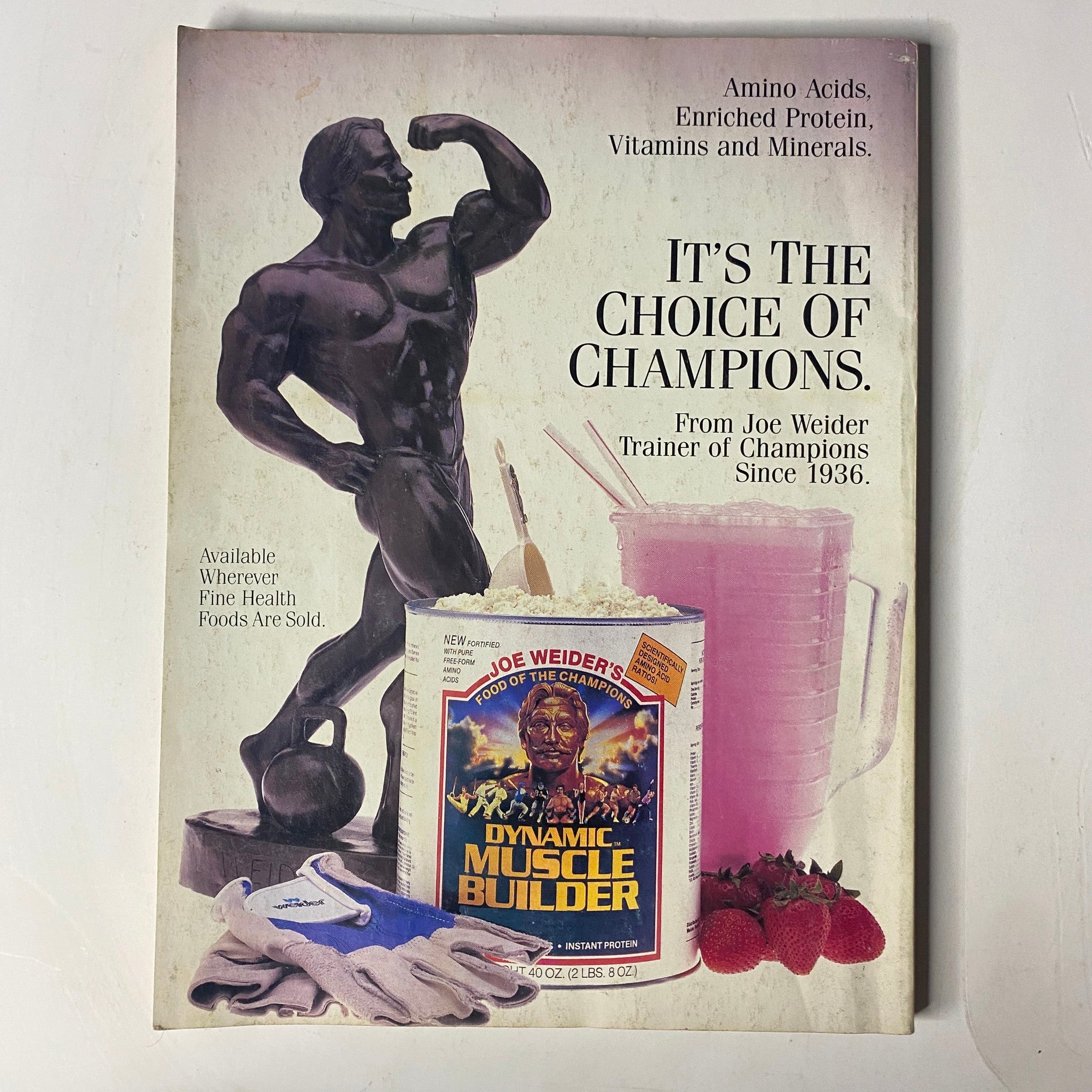 Muscle & Fitness Magazine November 1986 cover featuring a muscular statue, Joe Weider's Dynamic Muscle Builder product, and workout gloves, emphasizing nutrition choices for champions.
