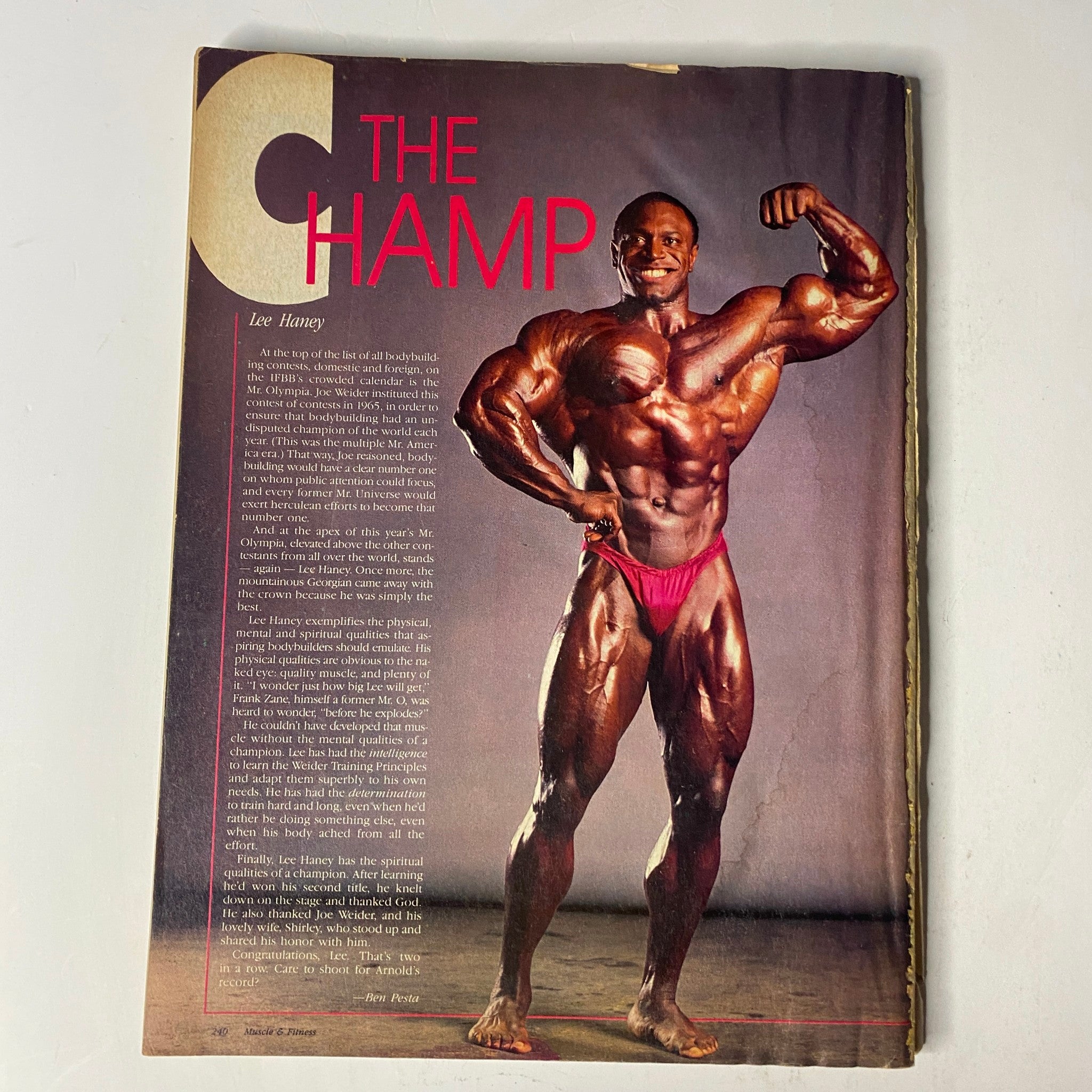 Feature on Lee Haney, titled 'The Champ', from Muscle & Fitness Magazine February 1986 showcasing the renowned bodybuilder in a striking pose.
