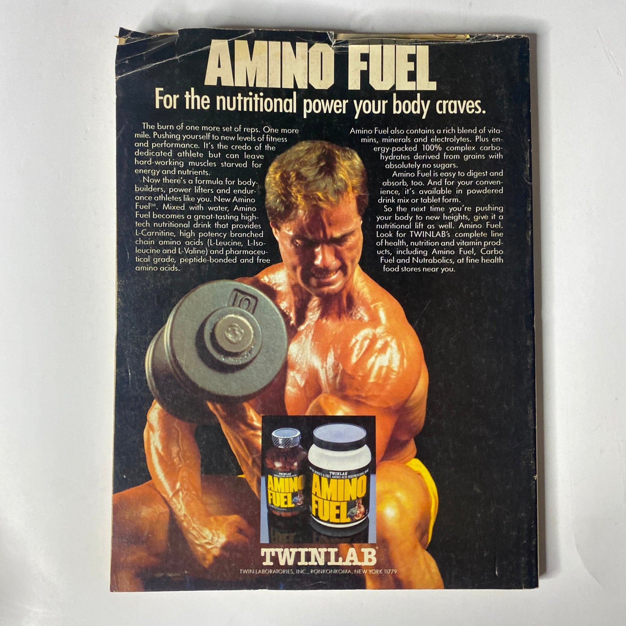Back cover of Muscle & Fitness Magazine August 1987 featuring an advertisement for Amino Fuel by Twinlab, emphasizing the nutritional power for bodybuilding.