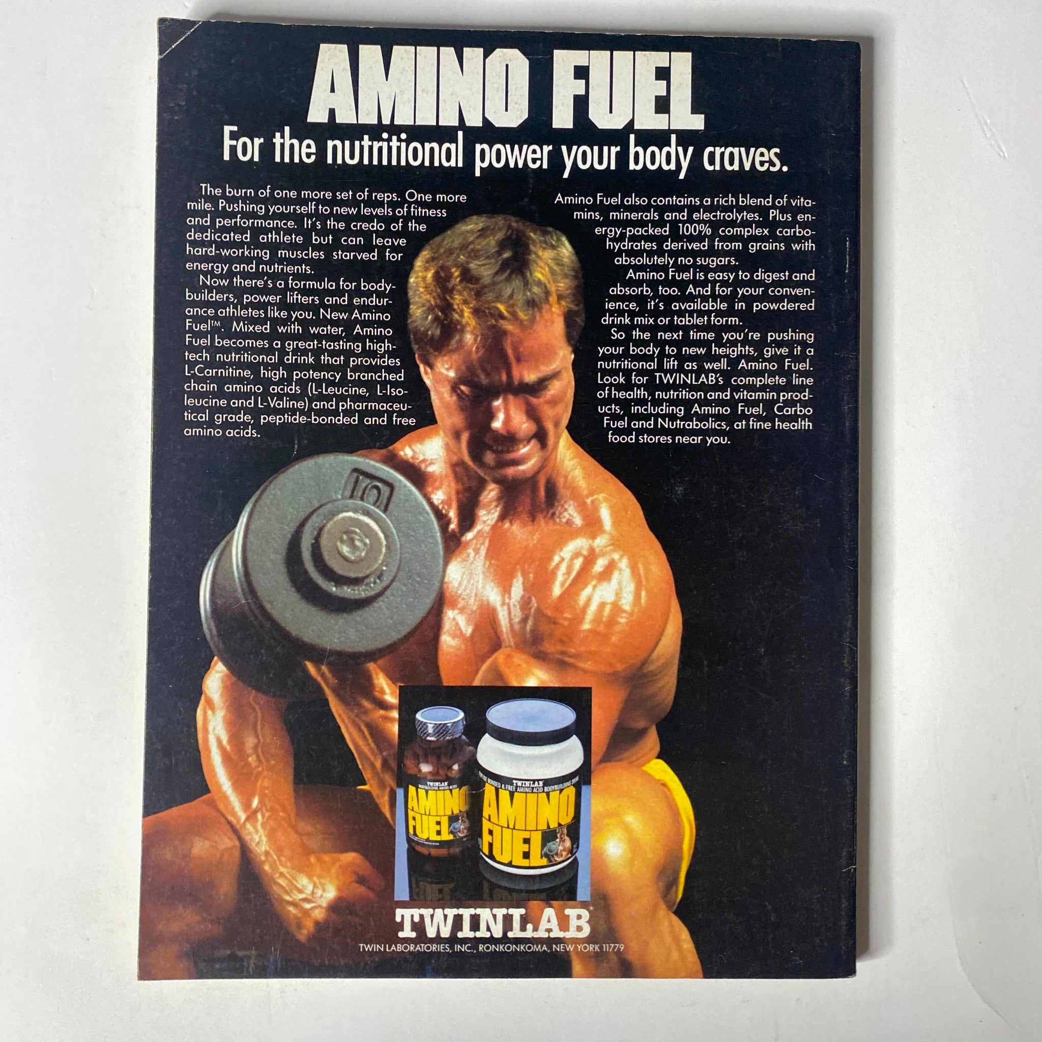 Back cover of Muscle & Fitness Magazine December 1987 featuring a muscular bodybuilder promoting Amino Fuel by Twinlab, showcasing the nutritional benefits of the product.