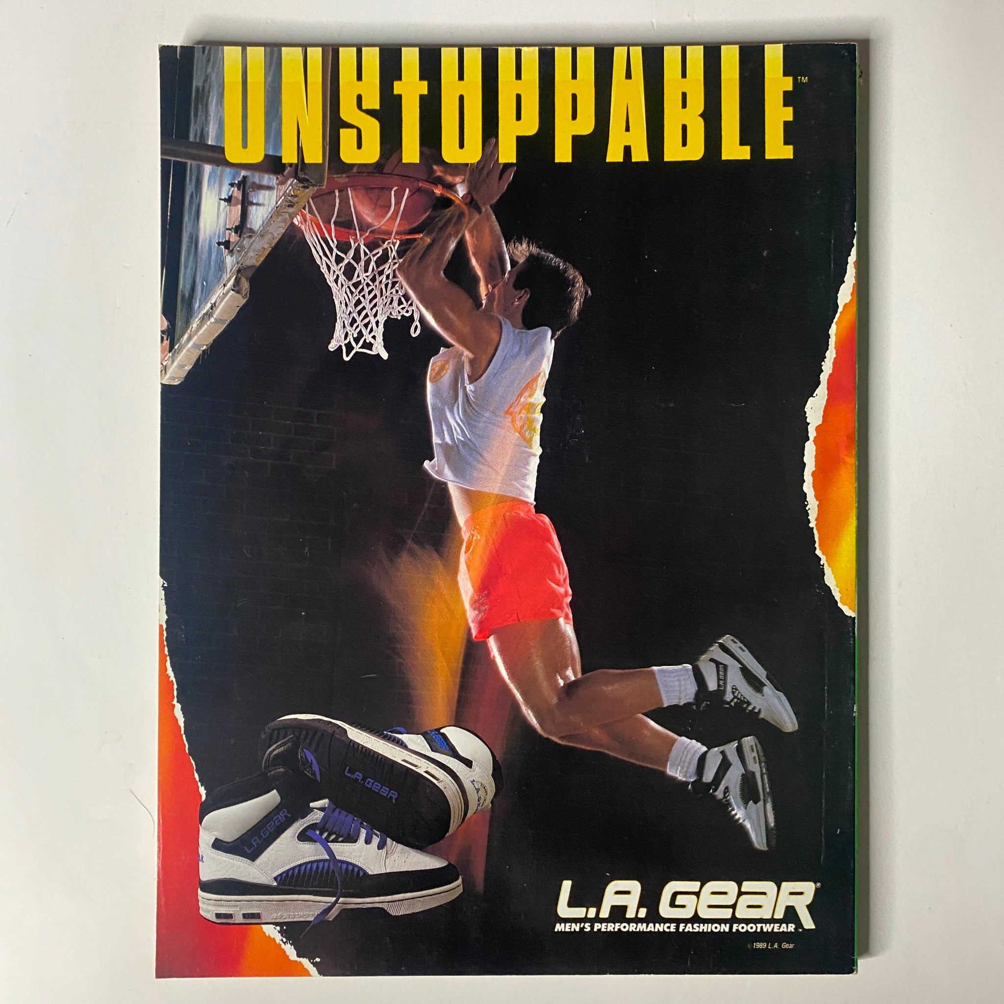 Advertisement page for L.A. Gear footwear, showcasing men's performance shoes with a basketball theme.