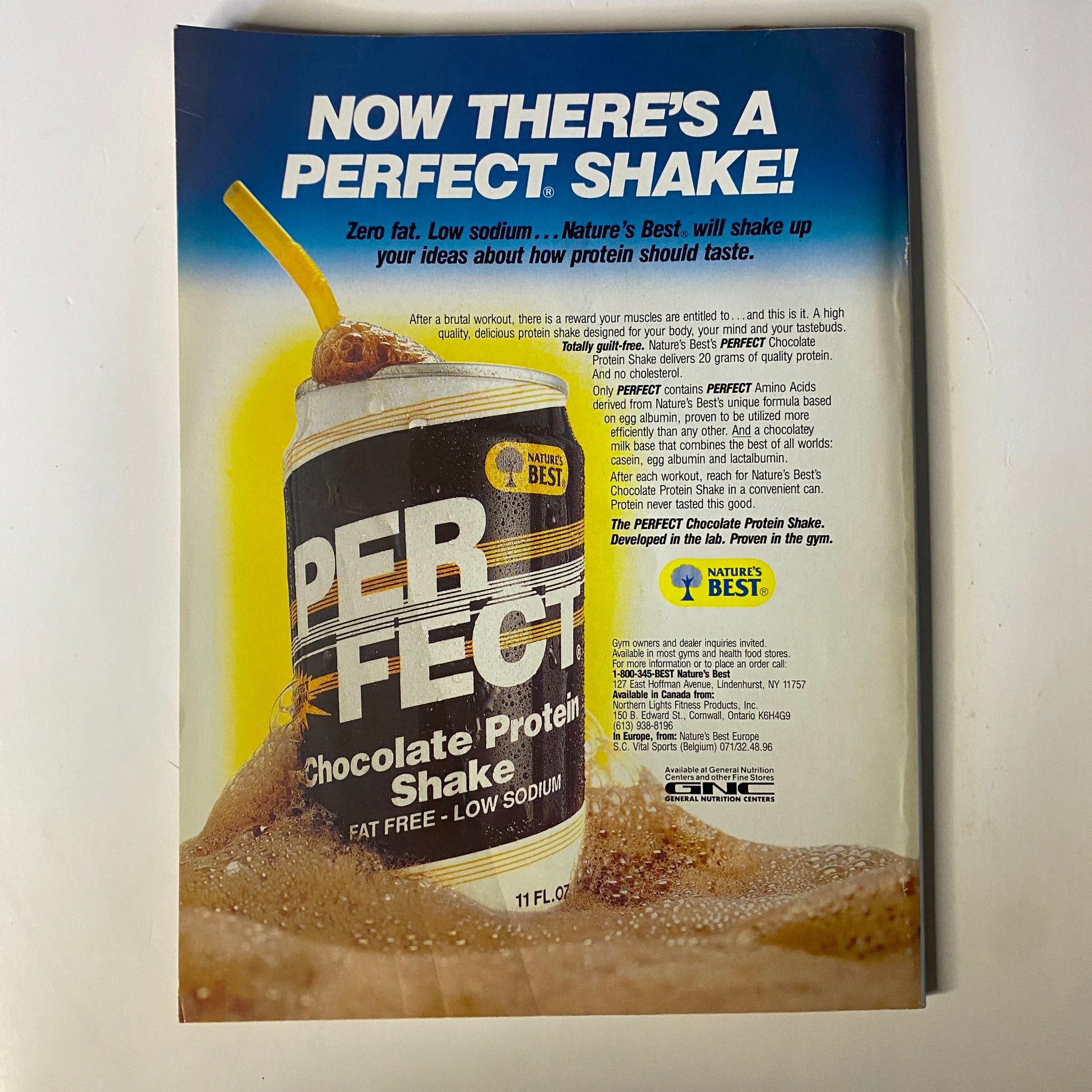 Back cover of Muscle & Fitness Magazine April 1990 promoting a Perfect Protein Shake with a splash image, highlighting health and fitness lifestyle.