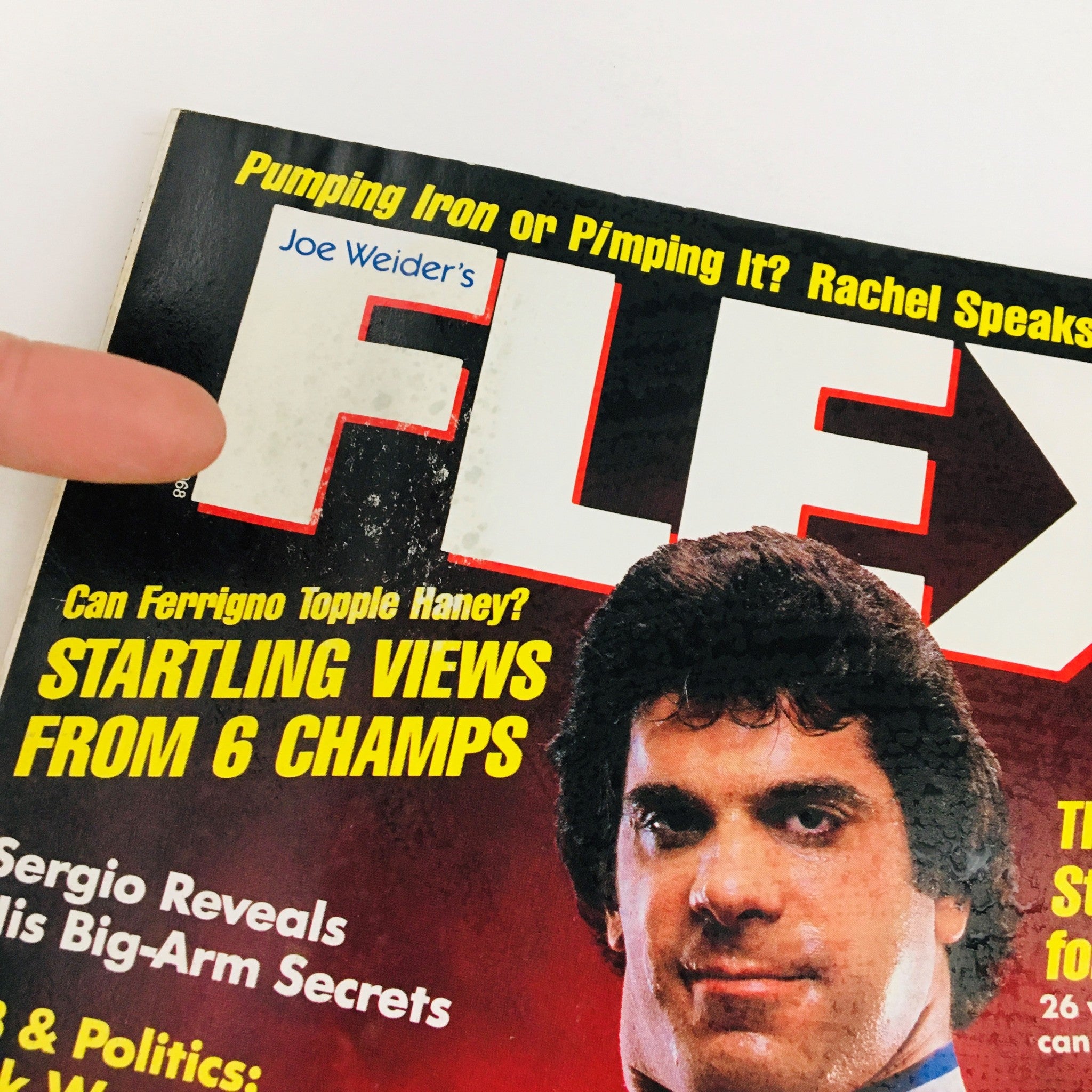 Close-up of the title section of Joe Weider's Flex Magazine August 1985, displaying the magazine's logo and text about bodybuilding topics.
