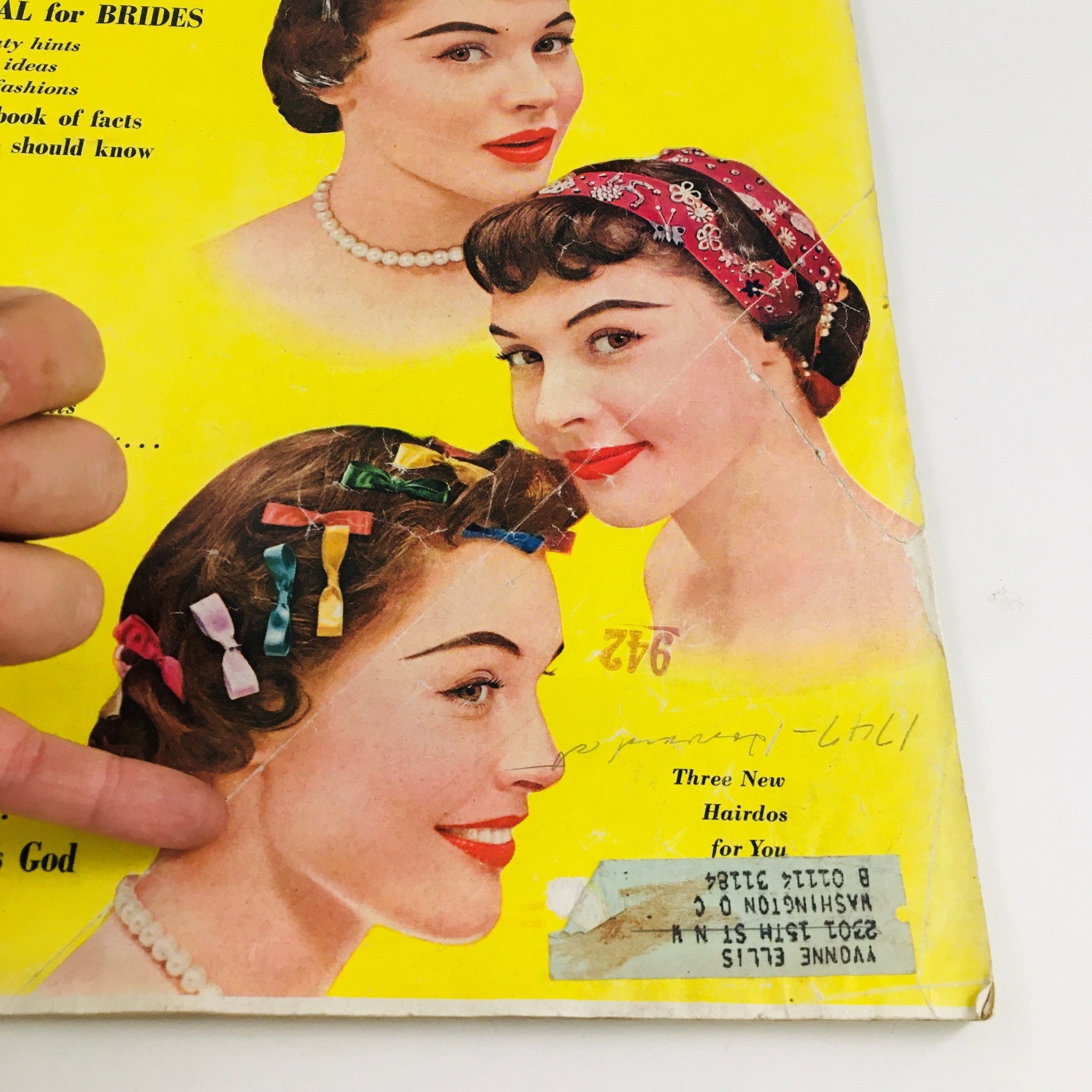 Image from Woman's Home Companion April 1954 displaying three hairstyles for brides, featuring women adorned with pearls and colorful hair embellishments.