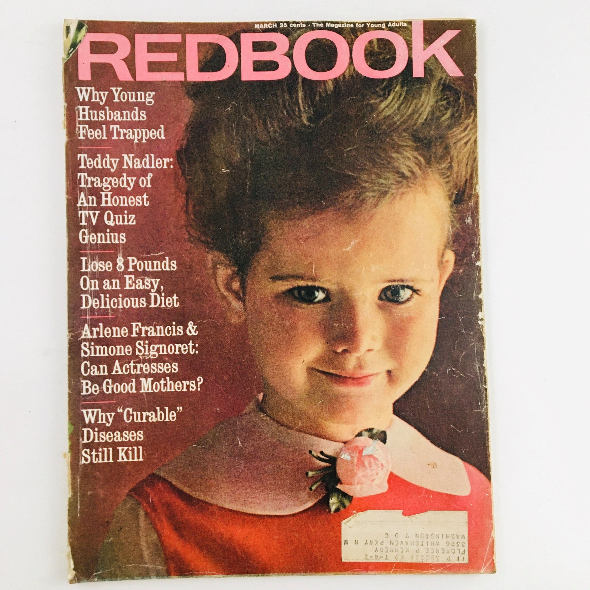 Cover of Redbook Magazine from March 1962 featuring the article 'Teddy Nadler: Tragedy of An Honest TV Quiz Genius'. The magazine showcases a young girl with big hair wearing a red dress with a pink flower, surrounded by colorful article titles.