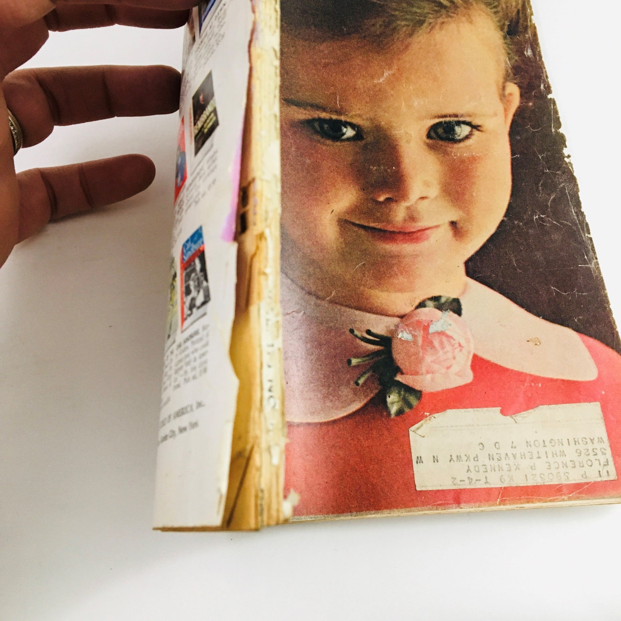 Back view of Redbook Magazine March 1962 showing further wear on the binding, emphasizing its age and authenticity. The magazine includes references to articles like 'Teddy Nadler: Tragedy of An Honest TV Quiz Genius'.