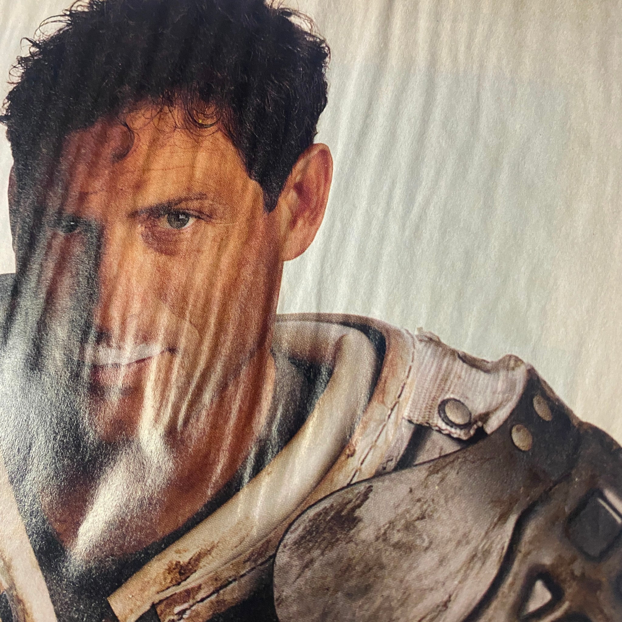 Close-up image of a fitness model from Muscle & Fitness Magazine July 1996, exhibiting intense focus and emotion, representing the magazine's dedication to fitness.