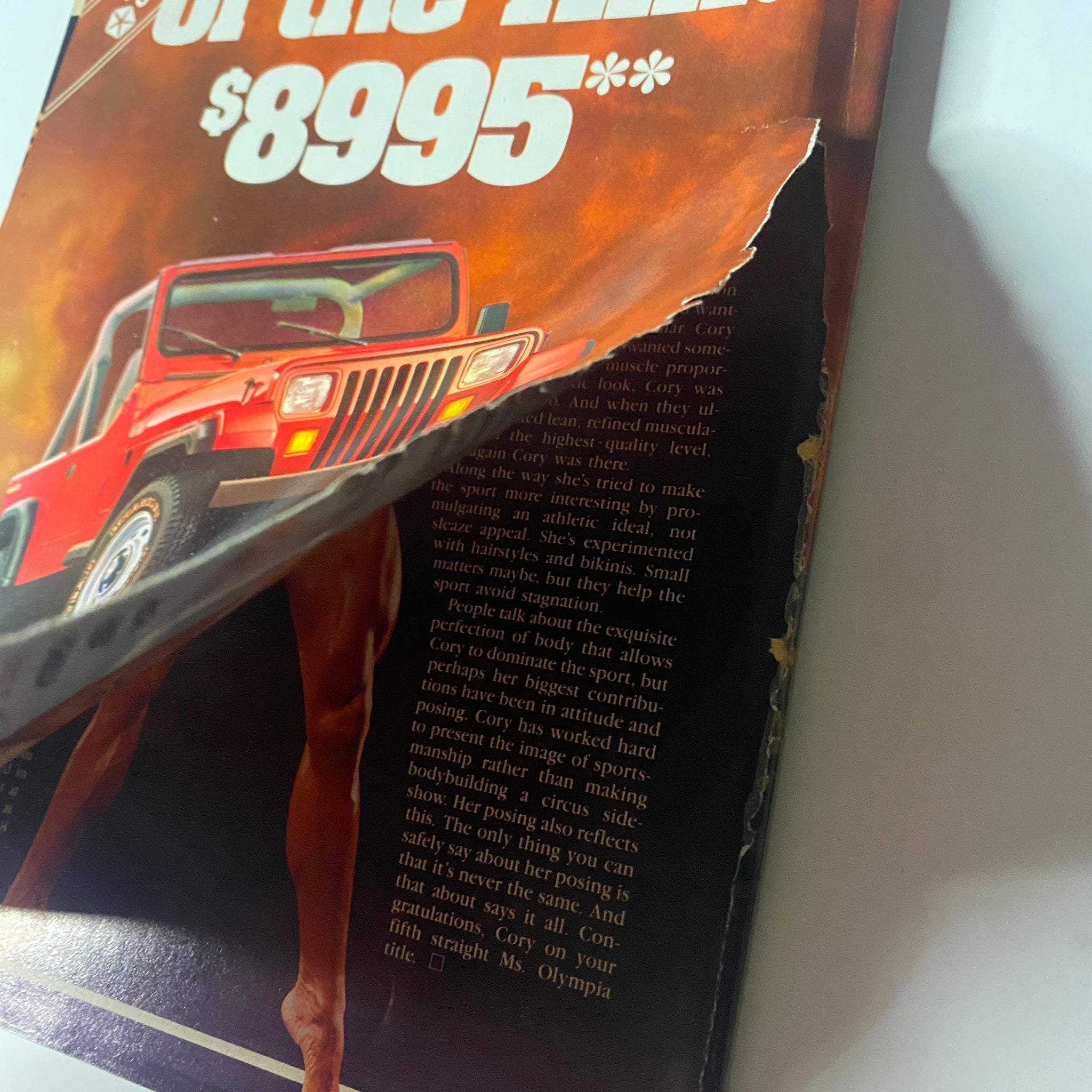 Detailed view of the back cover advertisement in Muscle & Fitness Magazine April 1989, highlighting the Jeep promotion with a close-up of the vehicle and related copy.