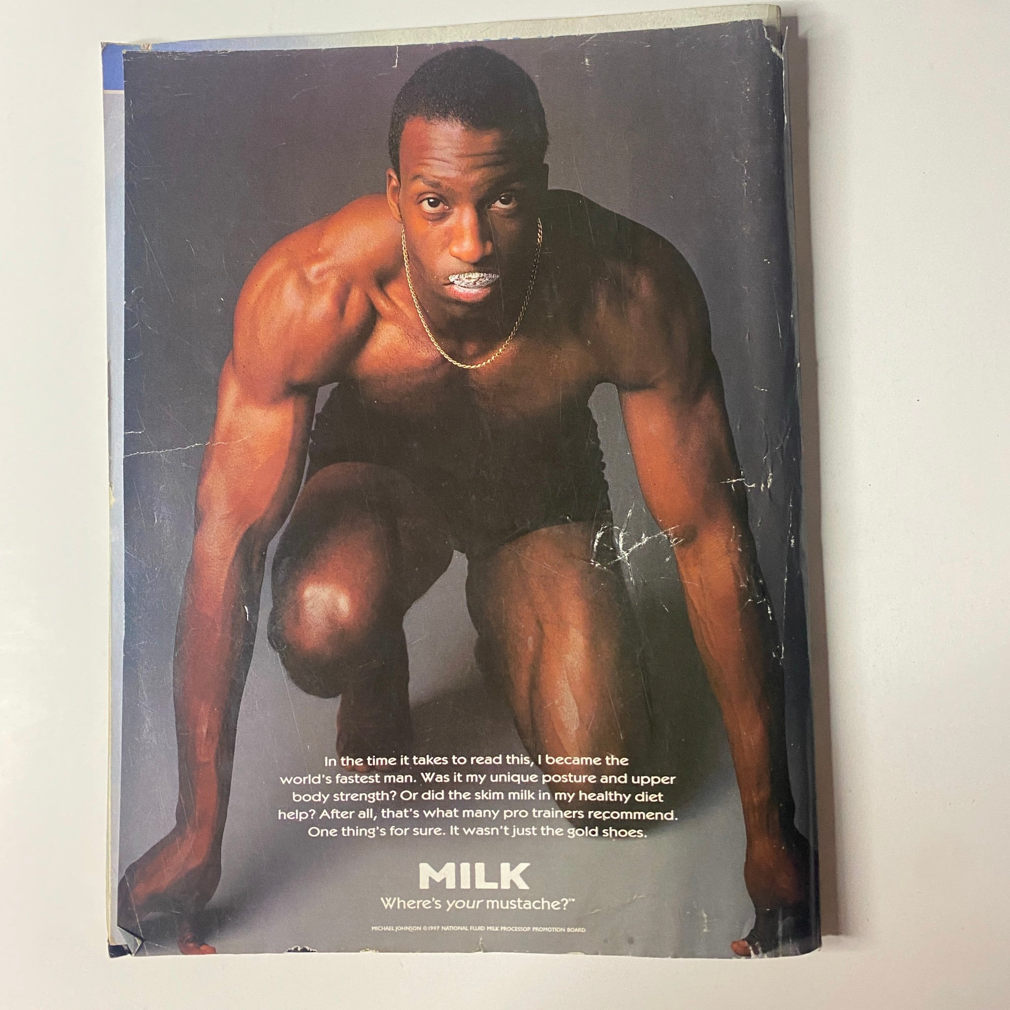Back cover of Muscle & Fitness Magazine, August 1997, featuring an advertisement for milk and showcasing a fitness model.