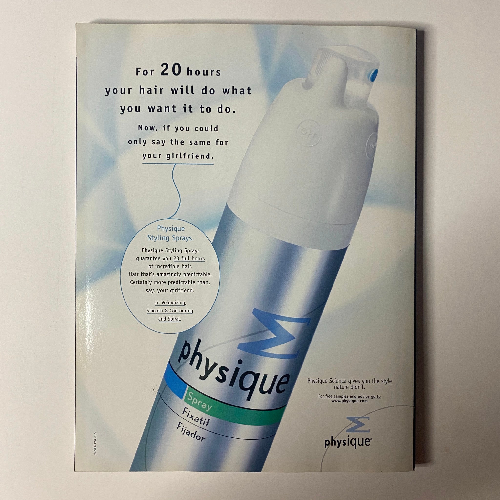 Advertisement for Physique Styling Spray from Muscle & Fitness Magazine September 2000 (Vol 61 No 9), showcasing a product that promises 20 hours of styling hold for hair.