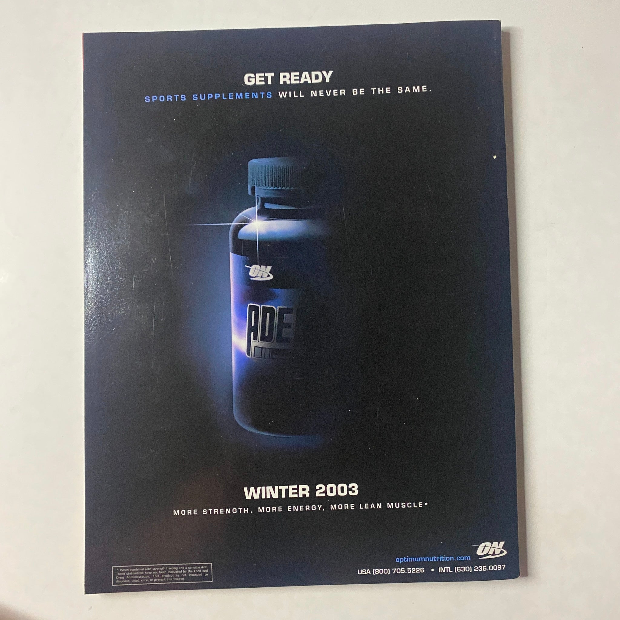 Back cover of Muscle & Fitness Magazine December 2003 featuring a promotional ad for sports supplements.
