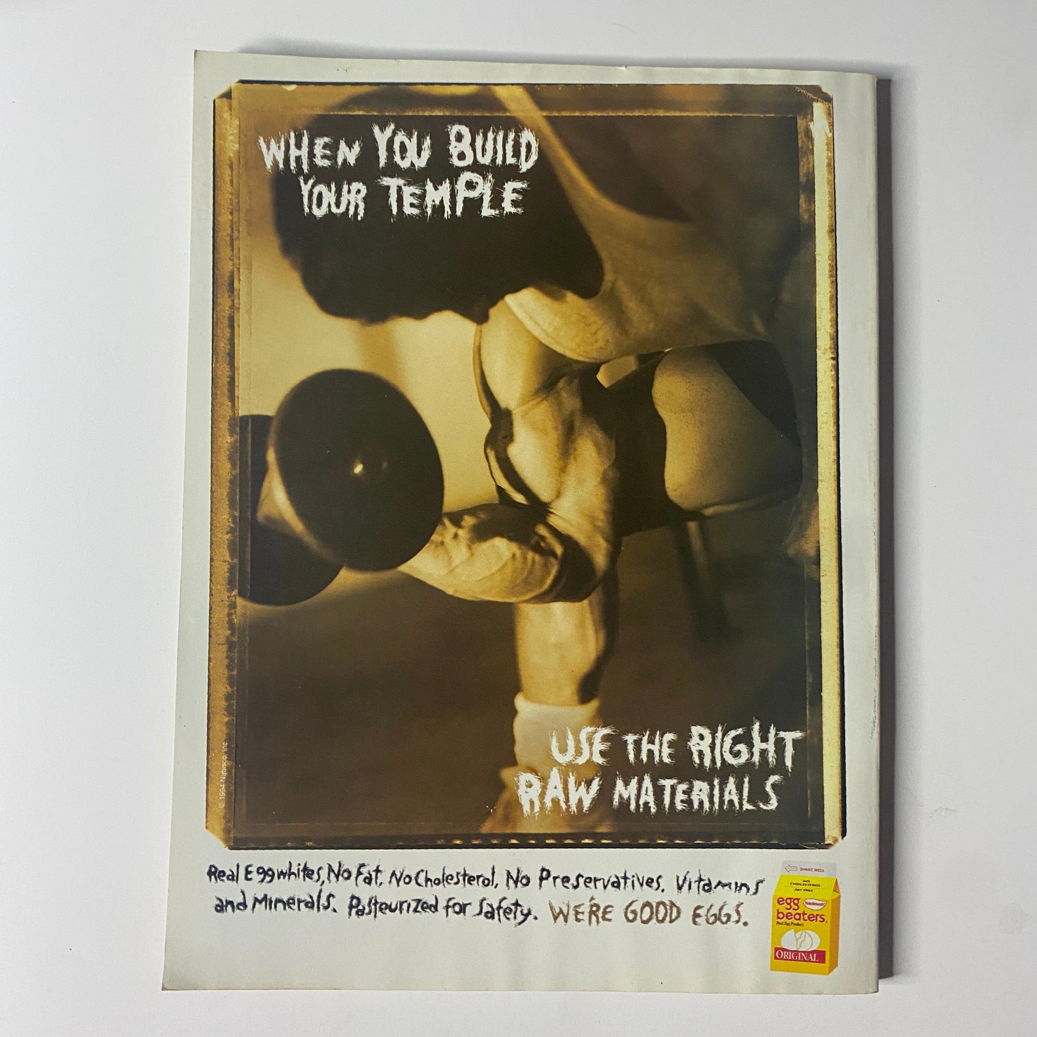 When You Build Your Temple: Use the Right Raw Materials. Muscle & Fitness Magazine May 1994 featuring Roger Stewart and Michelle Ruf, highlighting quality nutrition for bodybuilding.