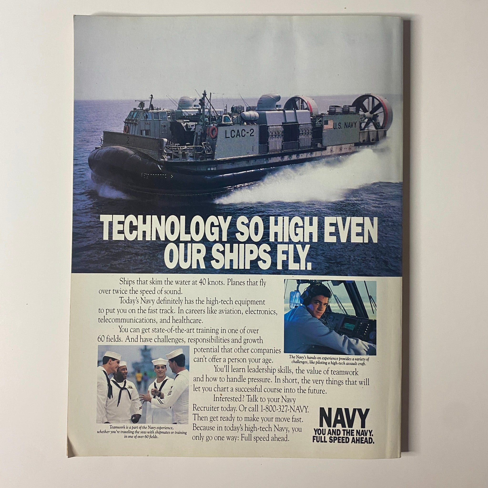 Technology advertisement showcasing a futuristic hovercraft, emphasizing 'Technology So High Even Our Ships Fly,' related to Navy recruitment. Featured in Muscle & Fitness Magazine February 1992, Vol 52, No 2 with Lee Labrada on the cover.