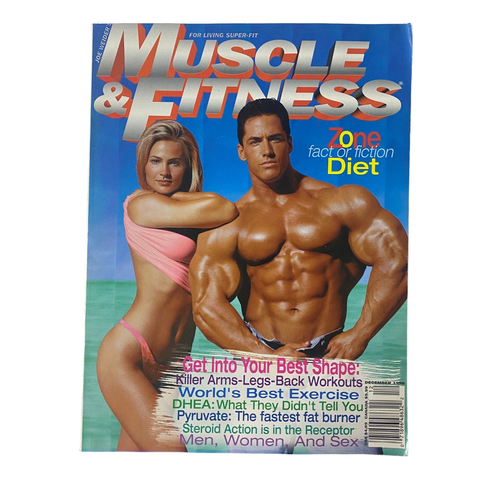 Muscle & Fitness Magazine December 1996 Vol 57 No. 12 featuring Dennis Newman on the cover with a female model, promoting fitness and bodybuilding.