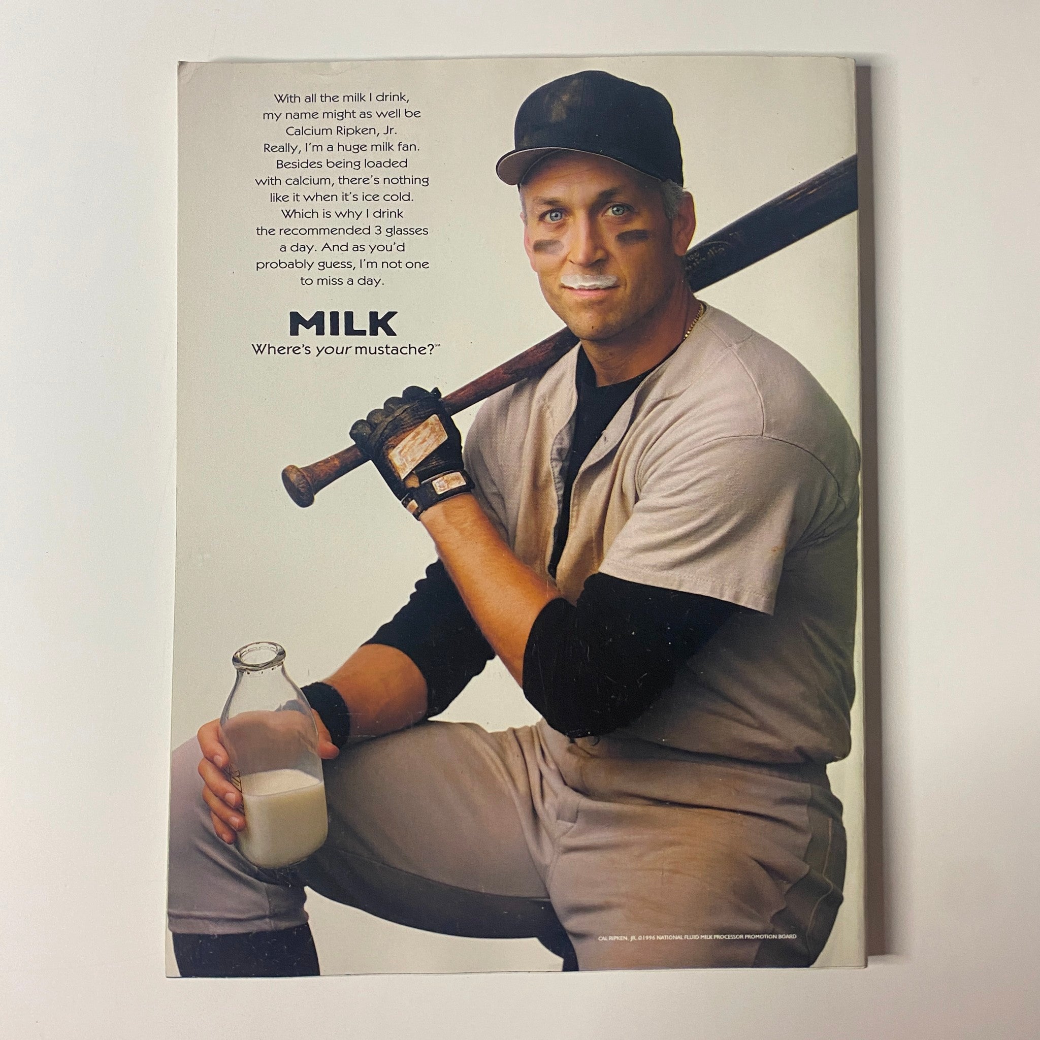 Advertisement in Muscle & Fitness Magazine December 1996 Vol 57 No. 12 showing a baseball player with a milk bottle, promoting calcium and fitness.