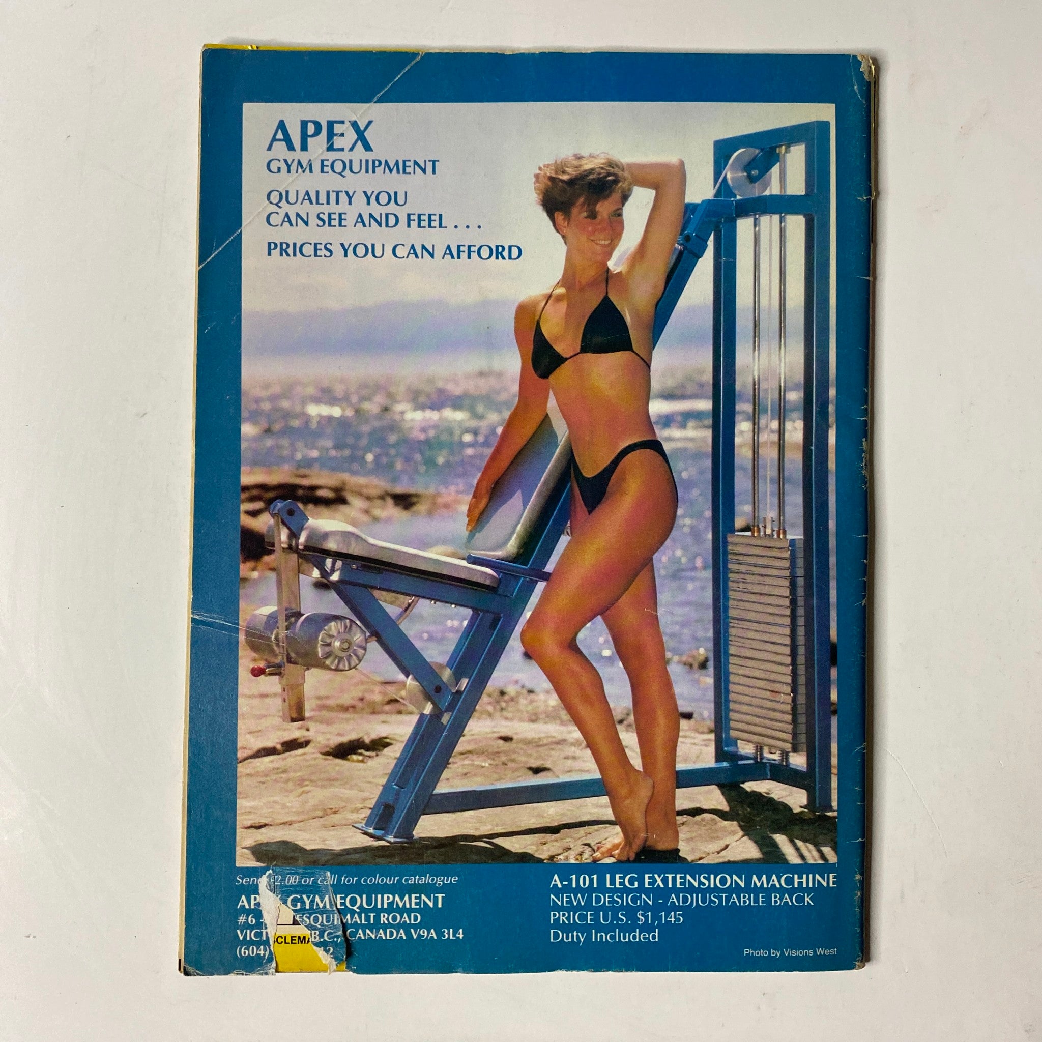 Back cover of MuscleMag International Magazine September 1988 No. 77 advertising Apex Gym Equipment with an image of a female model showcasing fitness equipment.