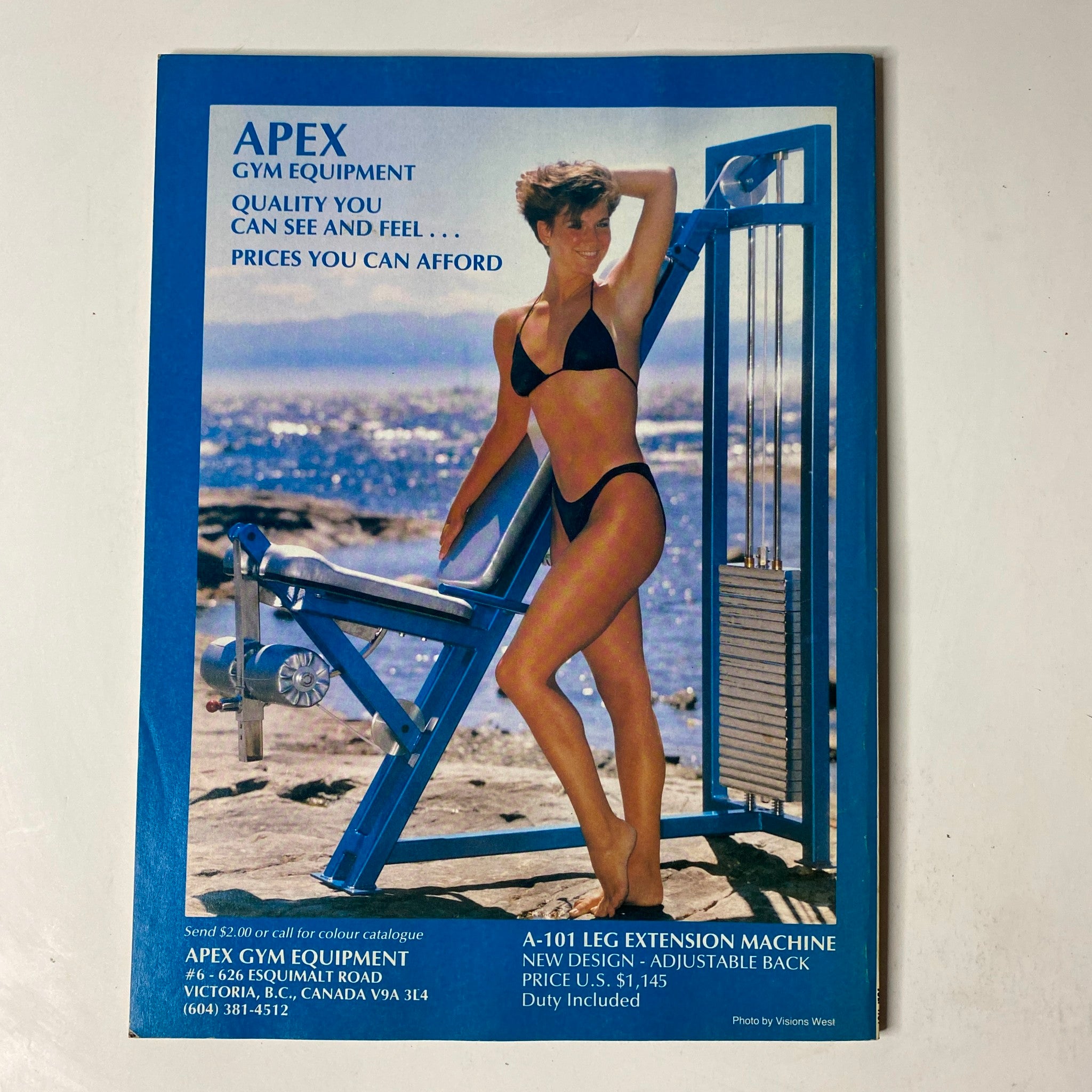 Advertisement page in MuscleMag International Magazine July 1989 for Apex Gym Equipment, displaying a model demonstrating a leg extension machine.