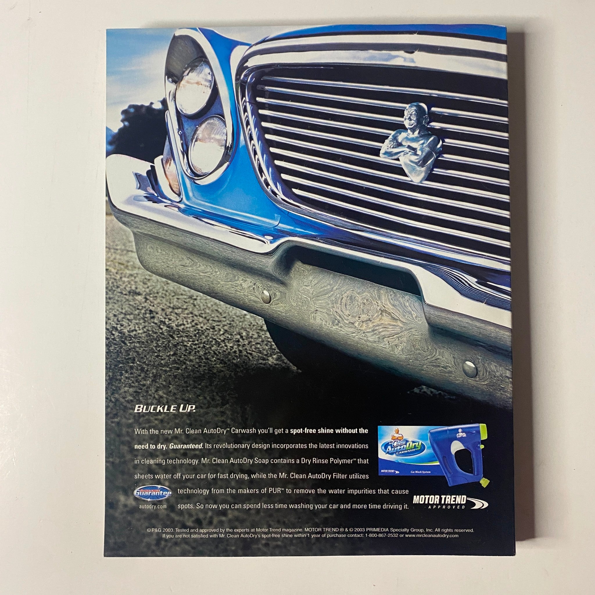 Advertisement for Mr. Clean AutoDry Car Wash on the back cover of Muscle & Fitness Magazine March 2004, promoting easy car cleaning without streaks.