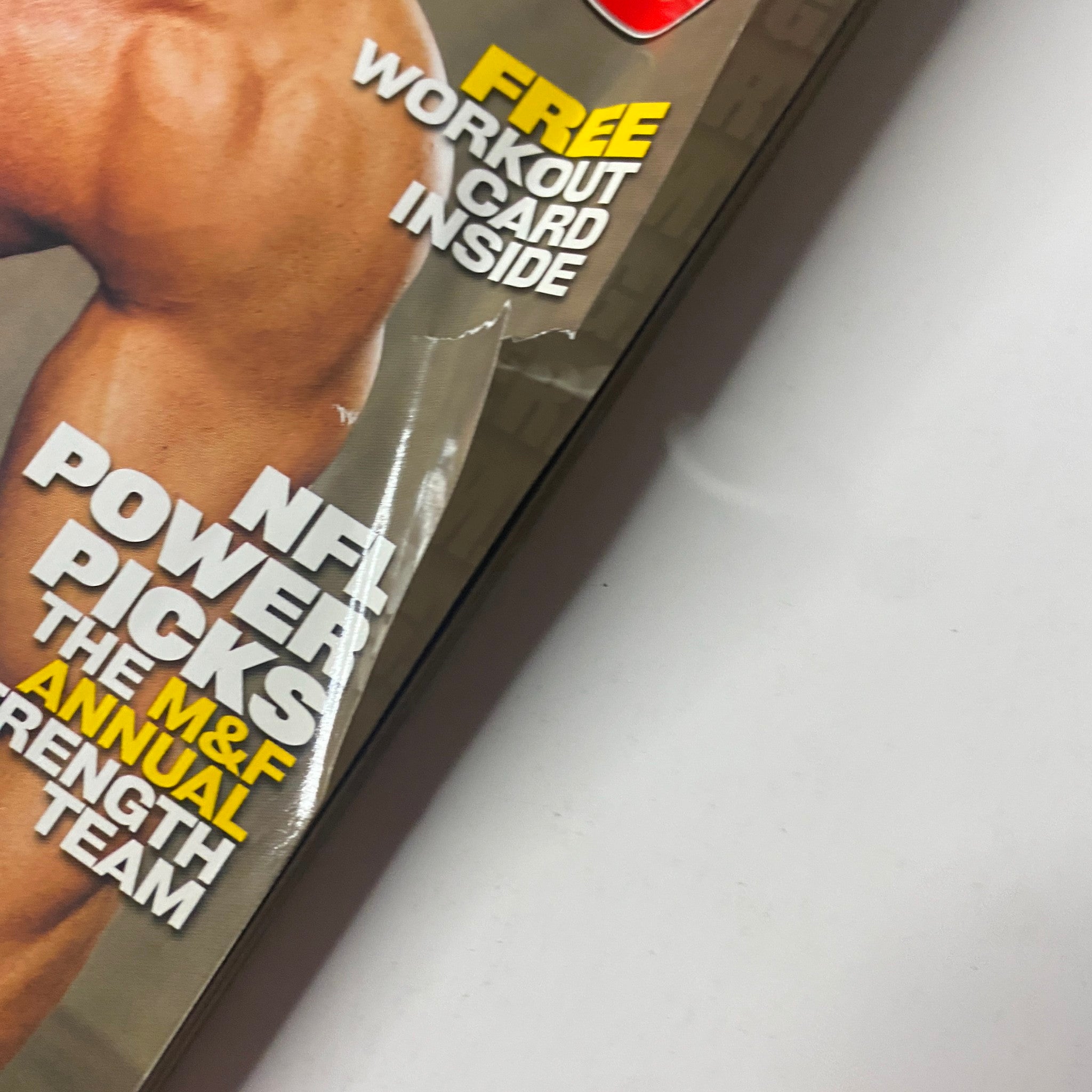 Close-up of the cover of Muscle & Fitness Magazine October 2003 Vol 64 No. 10 highlighting workout tips and features including NFL Power Picks.