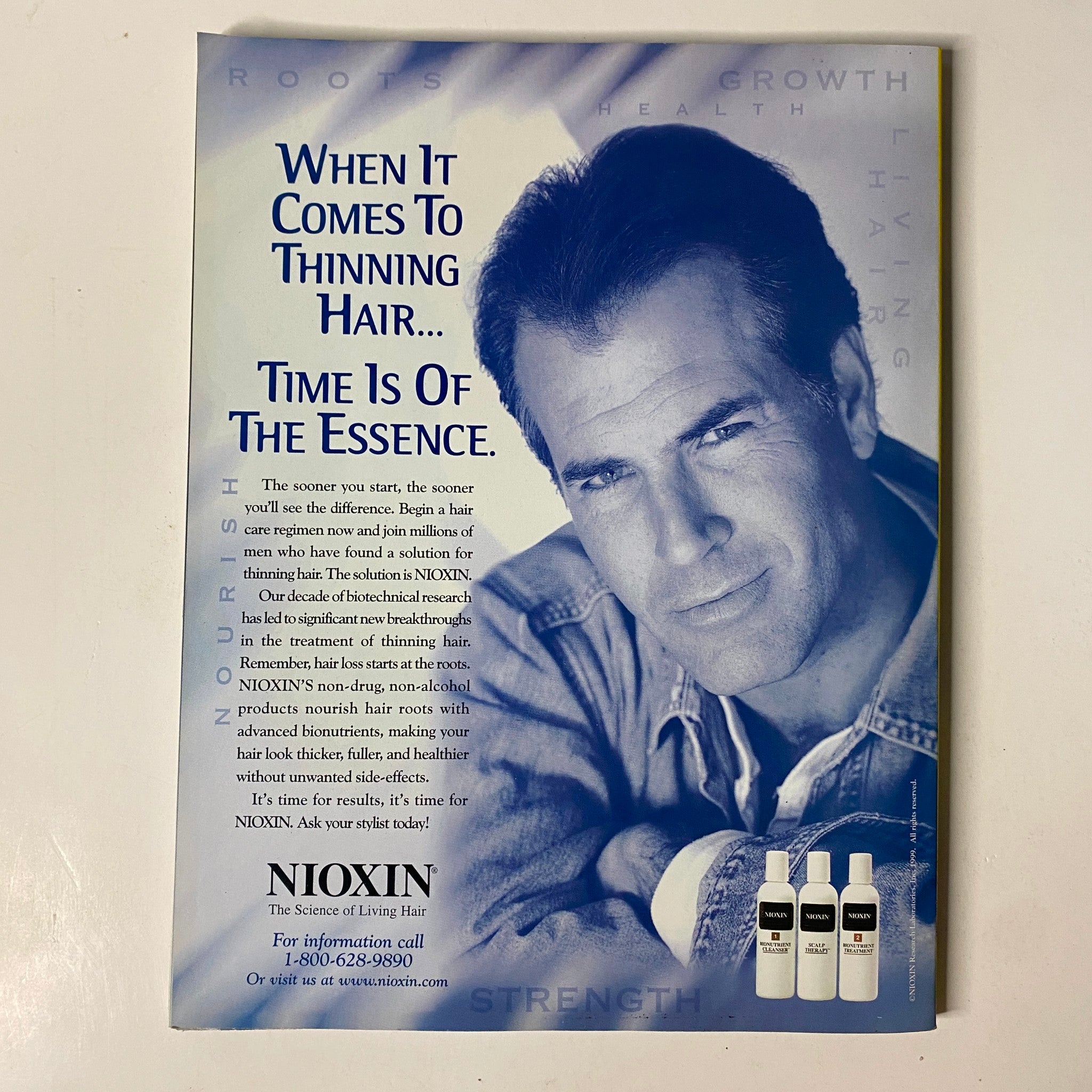 Muscle & Fitness Magazine May 2000 advertisement for Nioxin, focusing on hair care solutions for thinning hair, emphasizing its role in maintaining healthy hair.