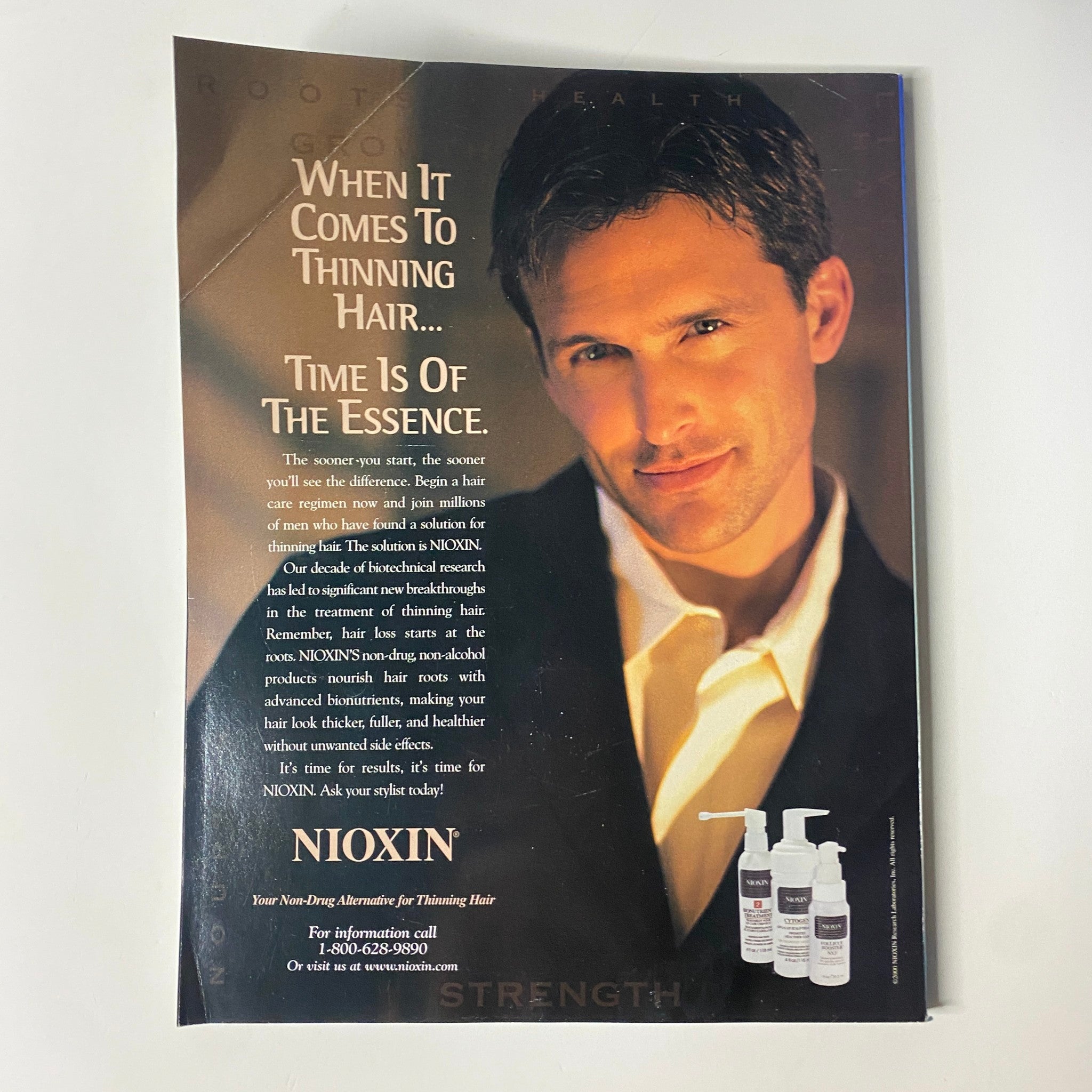 Advertisement featuring Nioxin product for thinning hair, emphasizing the importance of timely intervention, from Muscle & Fitness Magazine June 2000.
