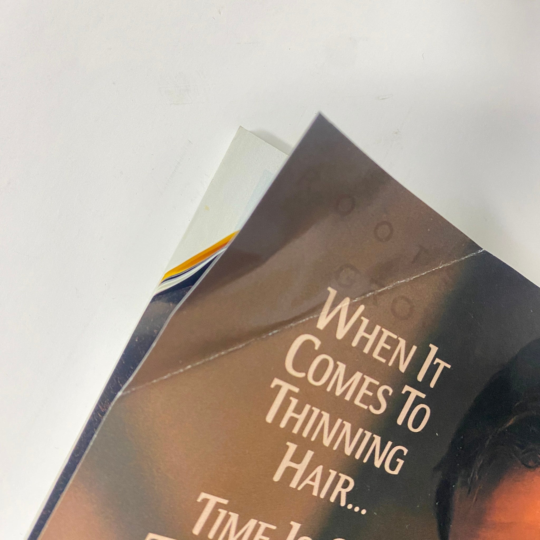 Close-up of Nioxin advertisement detailing hair loss solutions, showcasing the product's effectiveness, from Muscle & Fitness Magazine June 2000.