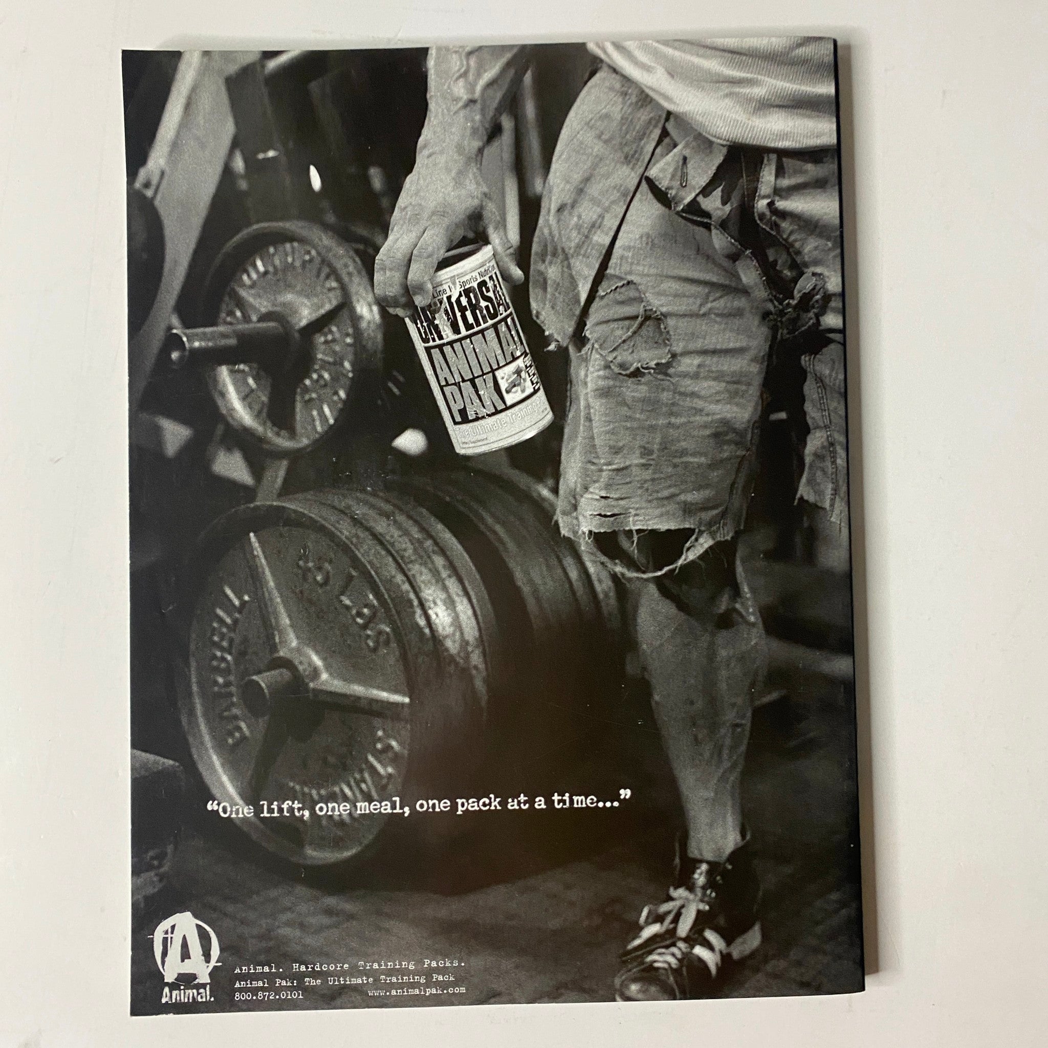 Muscle & Fitness Magazine June 2005 Vol 66 No. 6 showing an advertisement with a fitness enthusiast lifting weights, promoting the product 'Animal Pak' with the tagline 'One lift, one meal, one pack at a time...'.