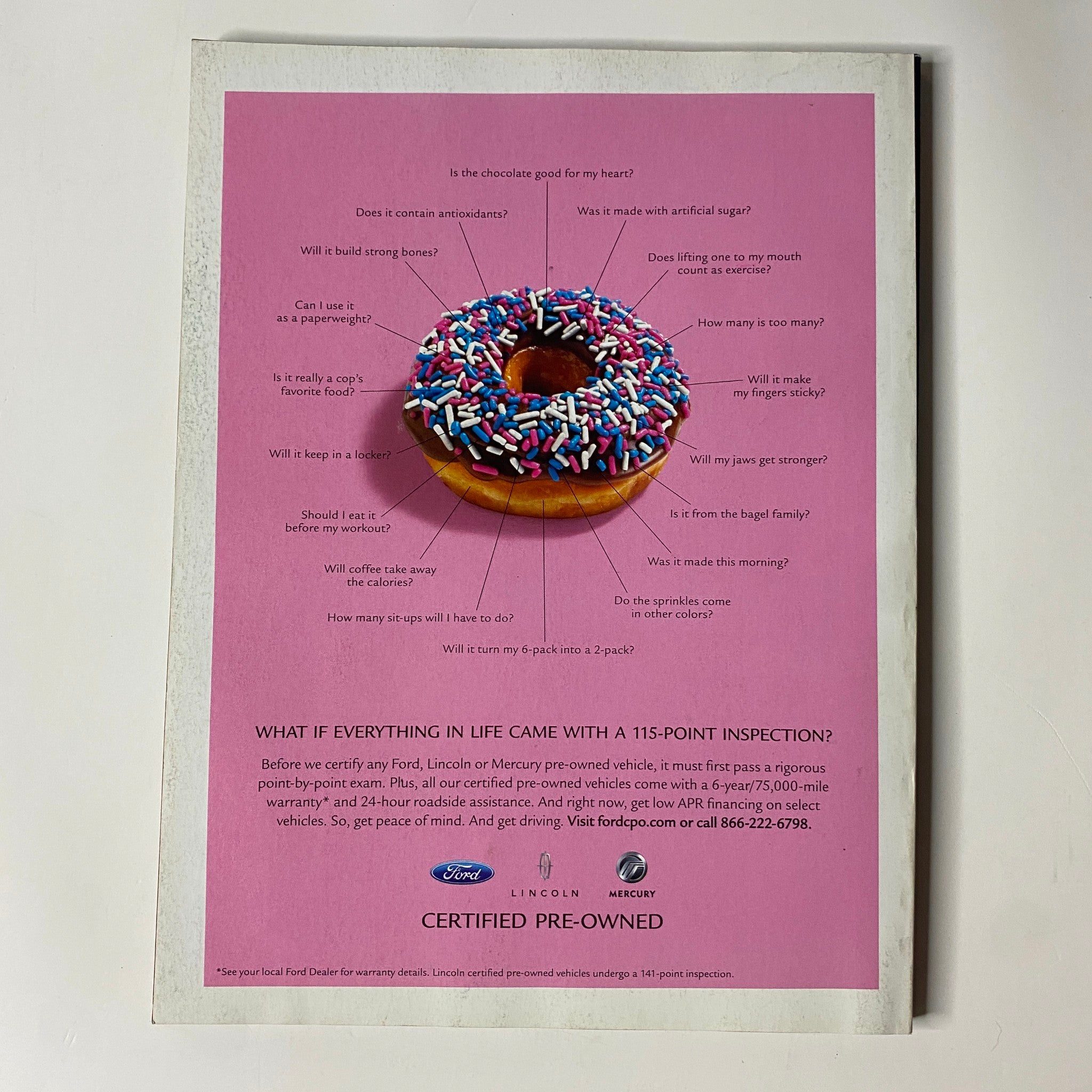 Muscle & Fitness Magazine September 2006 showcasing a colorful advertisement for a donut with sprinkles, illustrating a fun take on nutrition and lifestyle choices.
