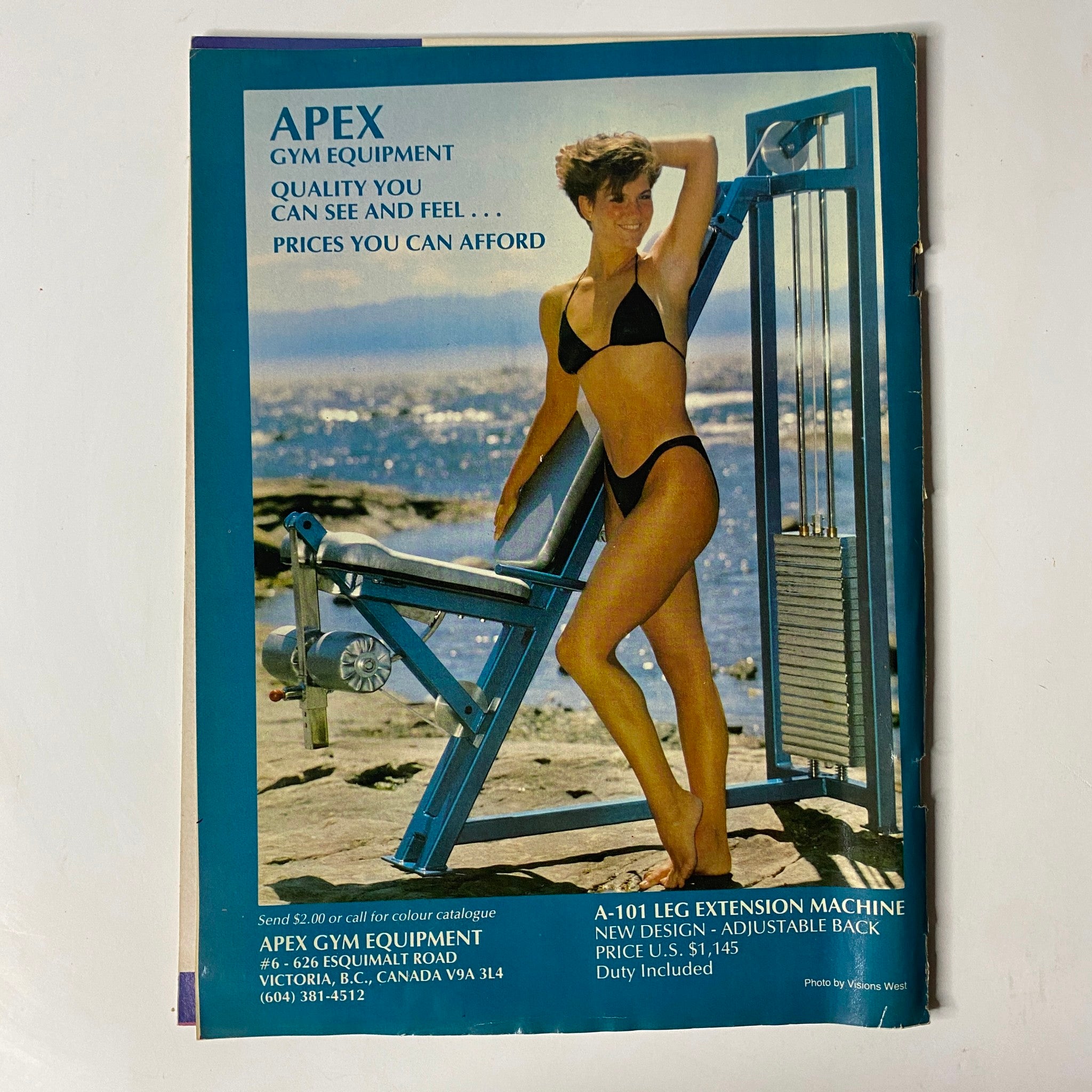 Advertisement for Apex Gym Equipment in MuscleMag International Magazine, October 1987, featuring a model in a bikini demonstrating gym equipment with a tagline on quality and affordability.