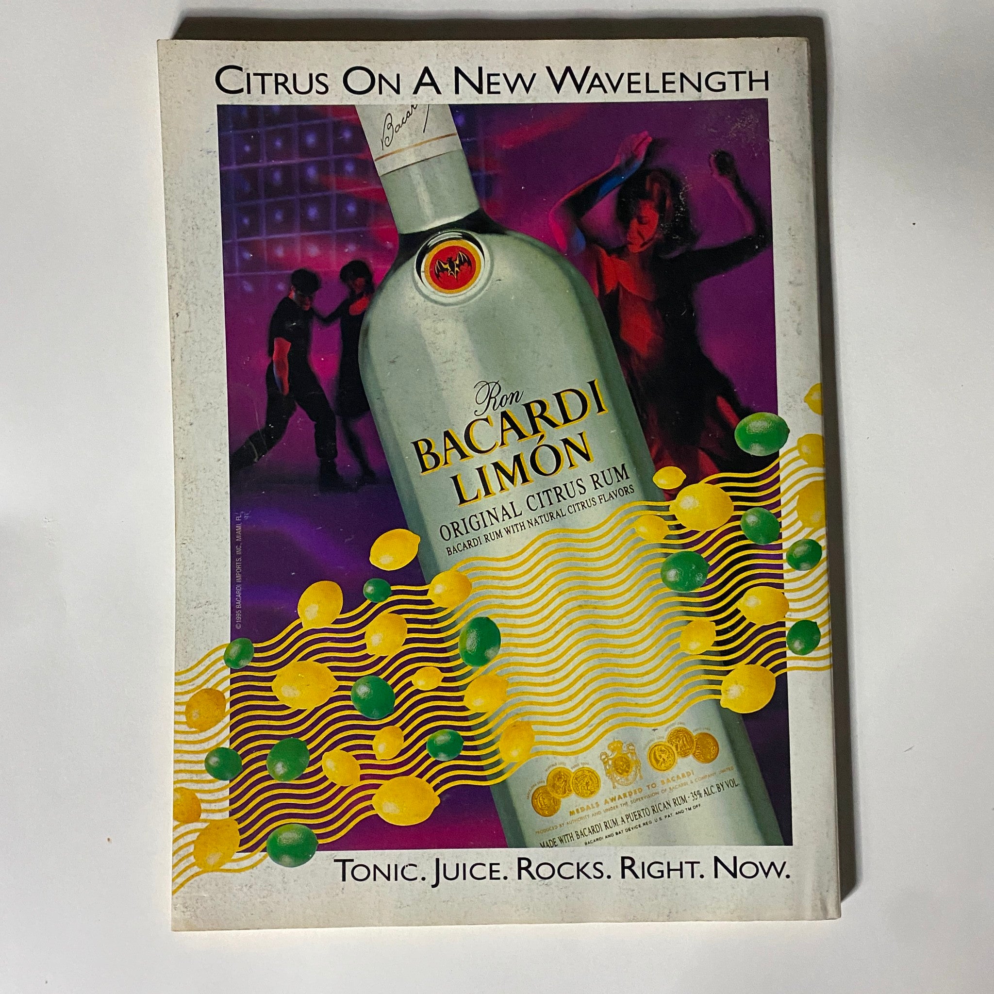 Advertisement page from Street & Smith's Pro Basketball Magazine, featuring Ron Bacardi Limón Rum with vibrant graphics and dancing figures.