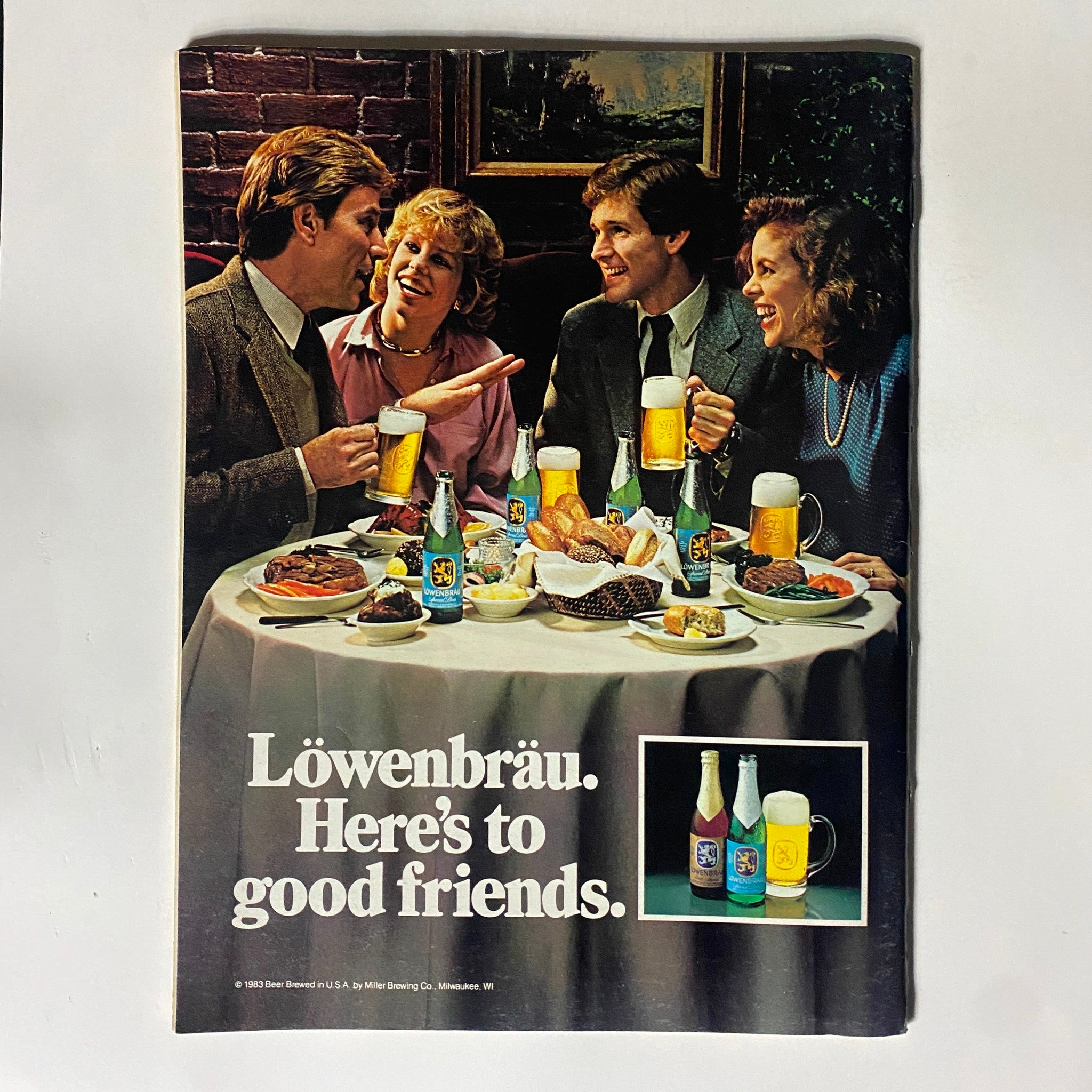 Vintage Löwenbräu advertisement featuring friends enjoying a meal and beer, emphasizing social connections.