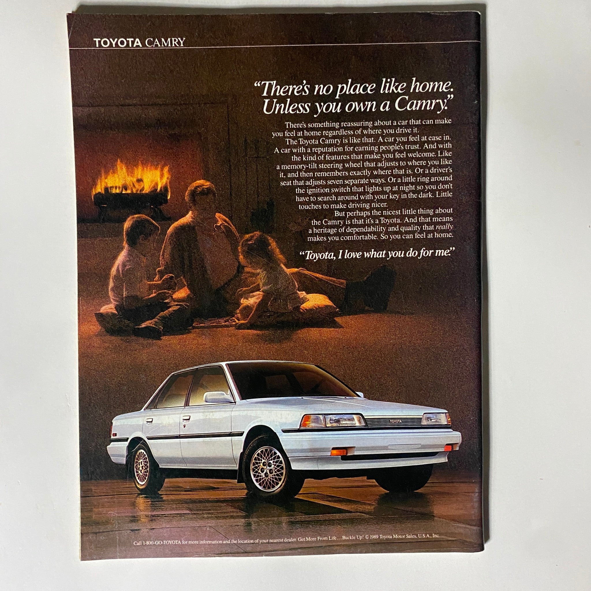 Advertisement page featuring a Toyota Camry with a family scene, from the New York Magazine issue dated May 7, 1990.
