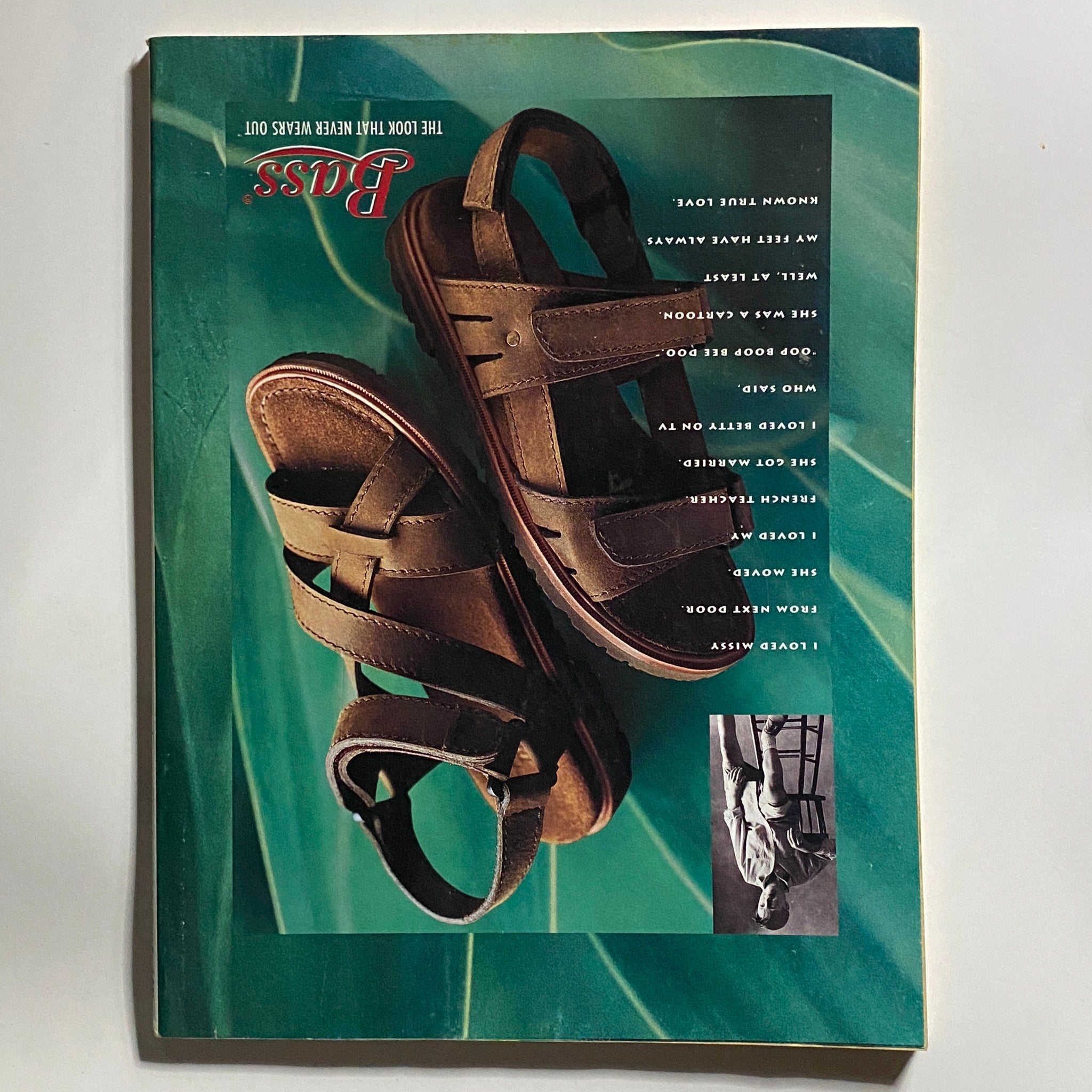 Cover of a BASS footwear catalog showcasing brown sandals on a green background, emphasizing style and comfort in casual footwear.