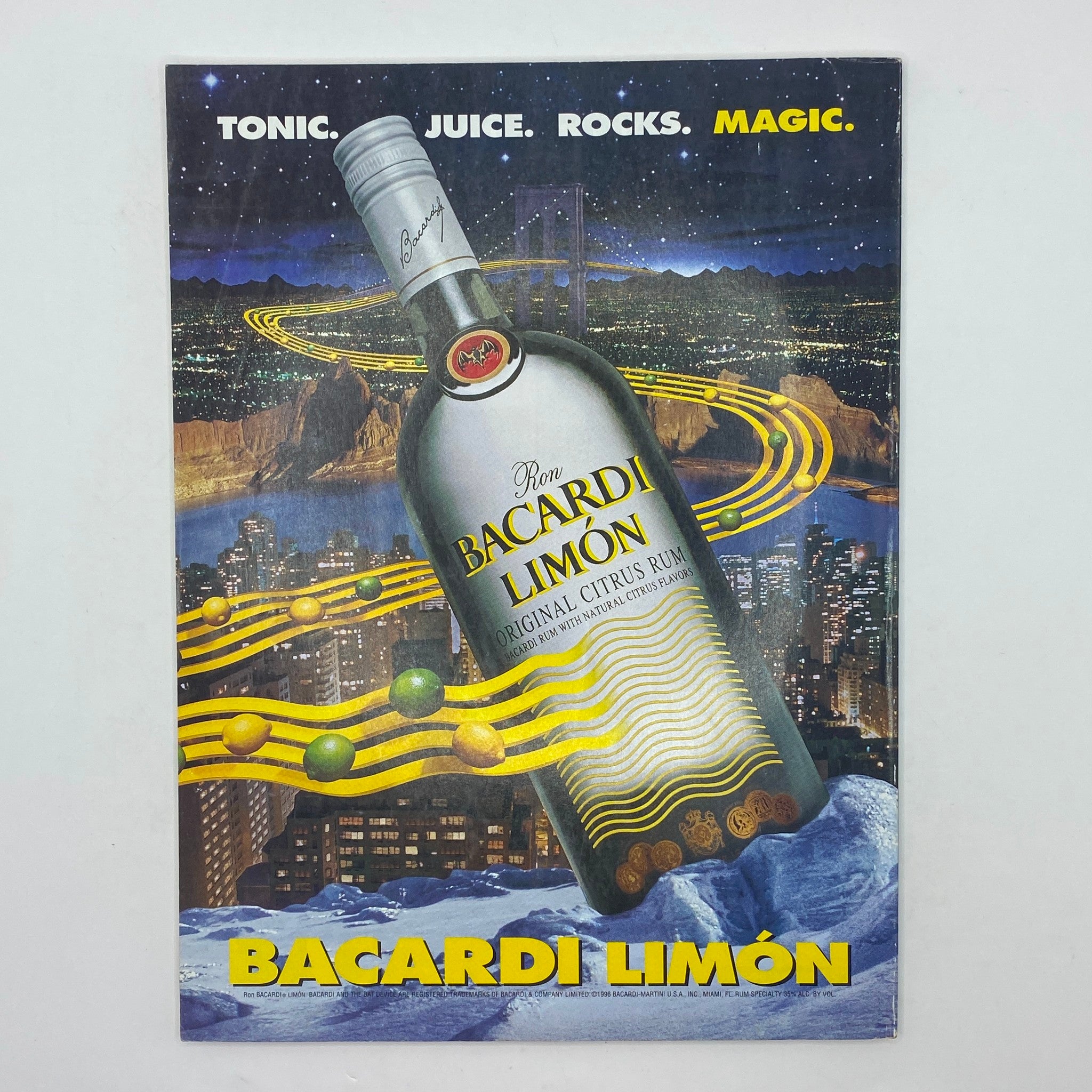 Bacardi Limón advertisement featuring a bottle against a night city backdrop with the tagline 'Tonic. Juice. Rocks. Magic.'.