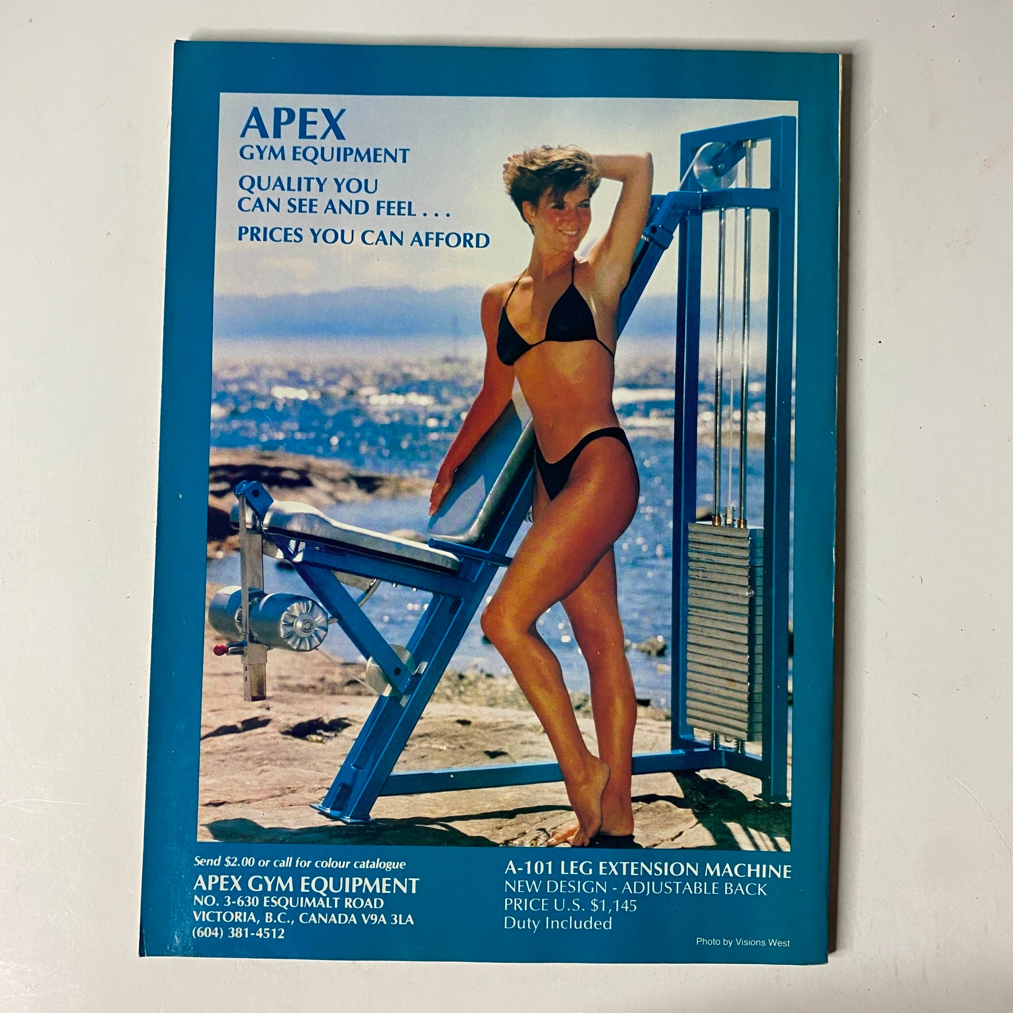 Advertisement for Apex Gym Equipment from MuscleMag International Magazine November 1989, featuring a model promoting gym equipment with pricing details.