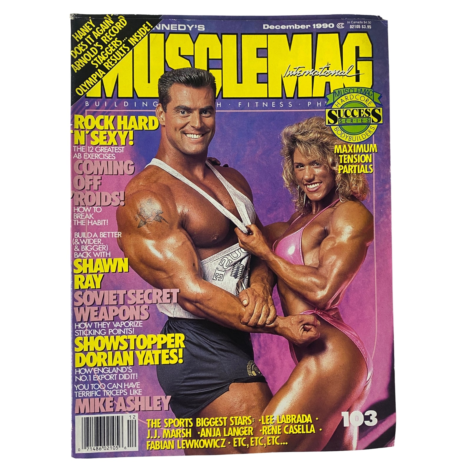 Cover of MuscleMag International Magazine, December 1990, No. 103 featuring Berry DeMey and Shelley Beattie with articles on bodybuilding and fitness.