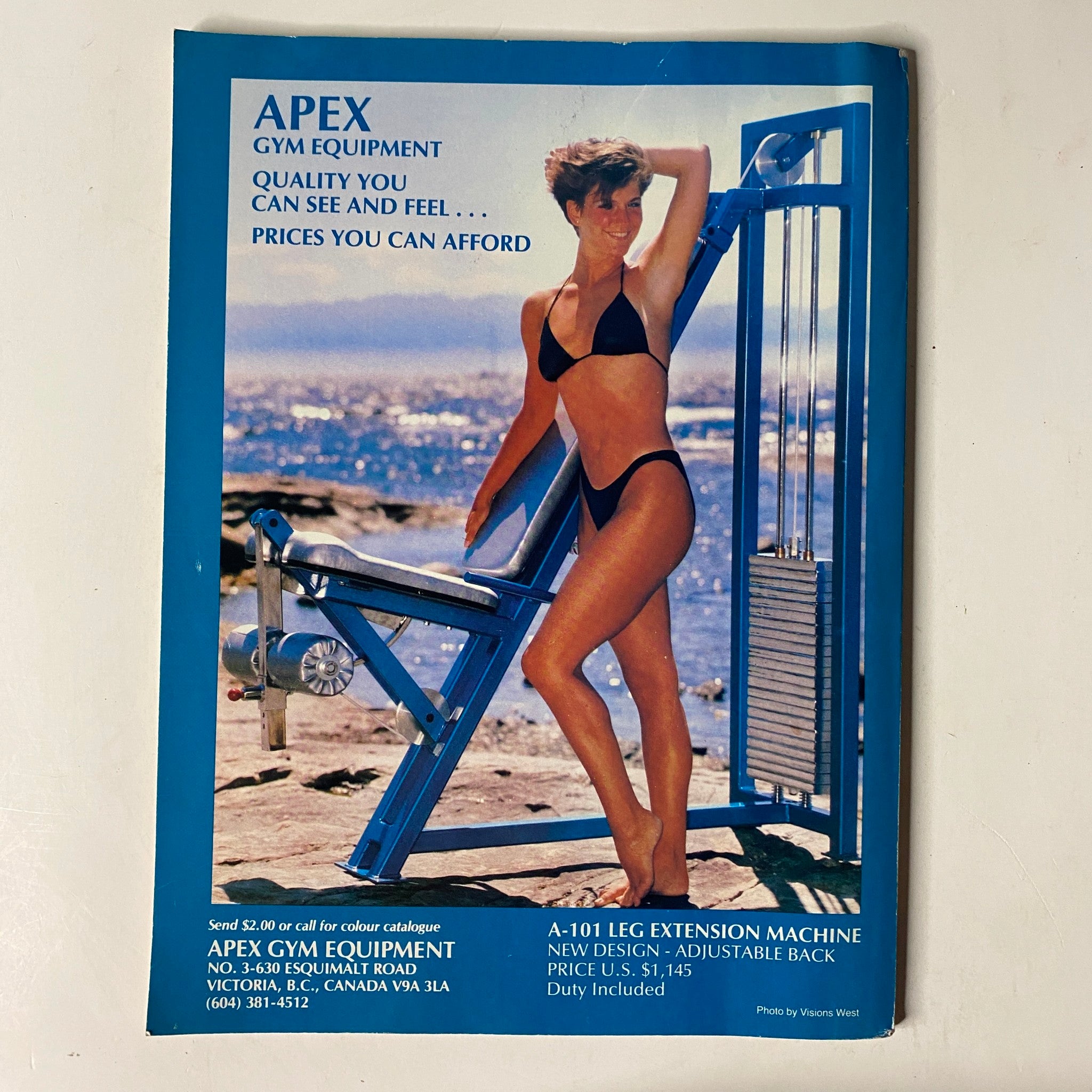Advertisement for Apex Gym Equipment in MuscleMag International Magazine March 1990 No. 94, promoting quality fitness equipment at affordable prices.