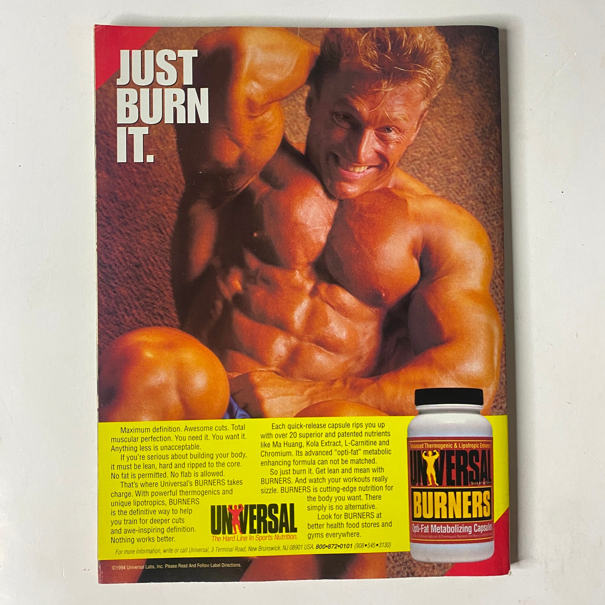 Advertisement page from MuscleMag International Magazine May 1994 No. 143 promoting Universal Burners, featuring a muscular male model and fitness product details.
