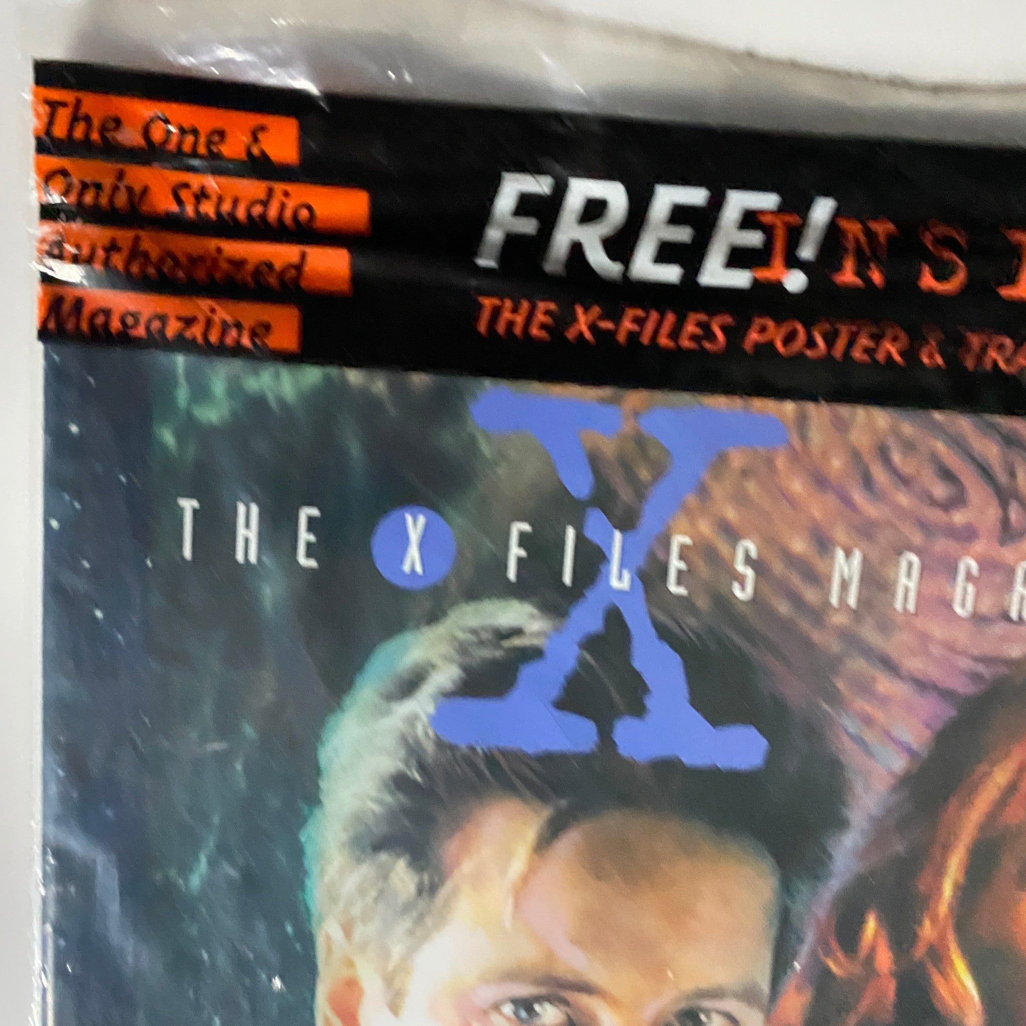 Cover of The X Files Magazine Winter 1996 #1 showing the title prominently with promotional text for a free poster inside.