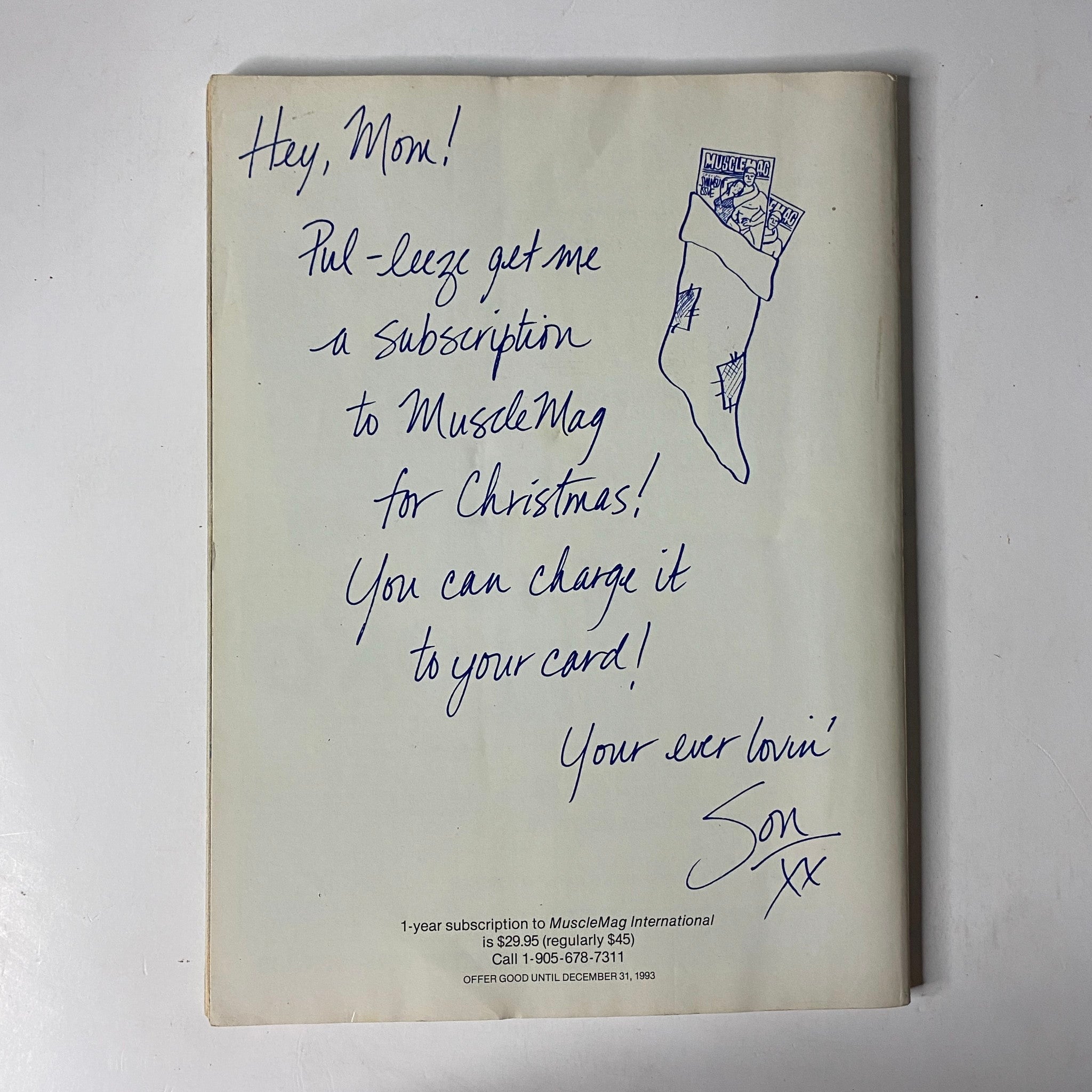 MuscleMag International Magazine July 1999 No. 205 Torrie Wilson – A playful handwritten note asking for a subscription to MuscleMag for Christmas, signed 'Son', accompanying the magazine cover.