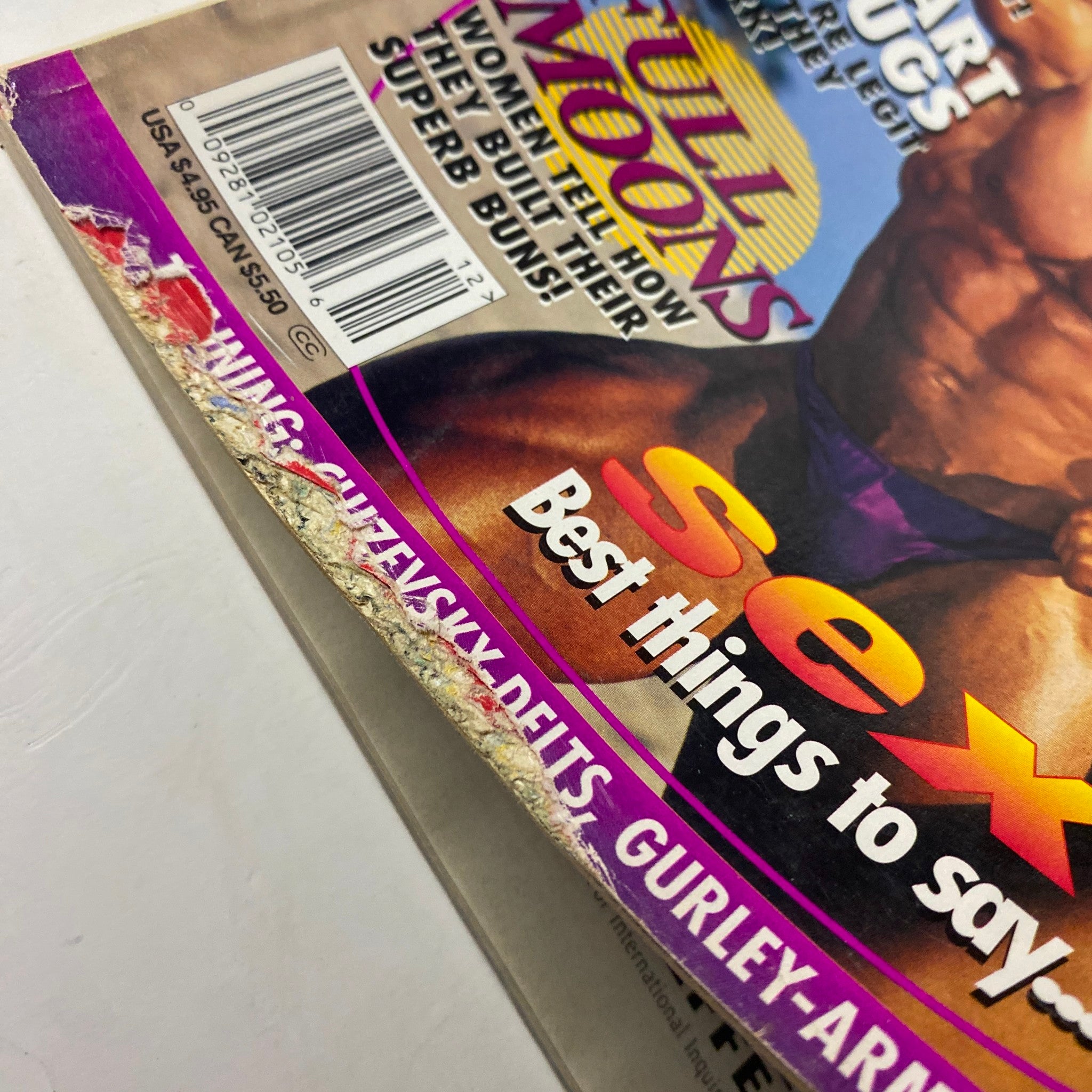 Close-up of the corner of MuscleMag International Magazine December 1995 No. 162 showing wear and creases, with keywords 'Full Moons' and 'Best things to say...'.